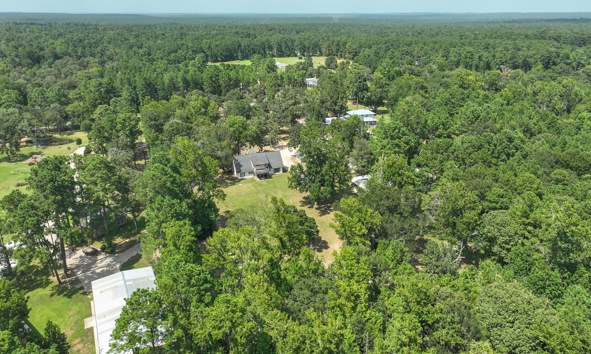 Create your very own outdoor pool retreat on 5 beautiful acres. Two homes, no HOA, low tax rate, private well, and separate septic systems offer flexibility and freedom.