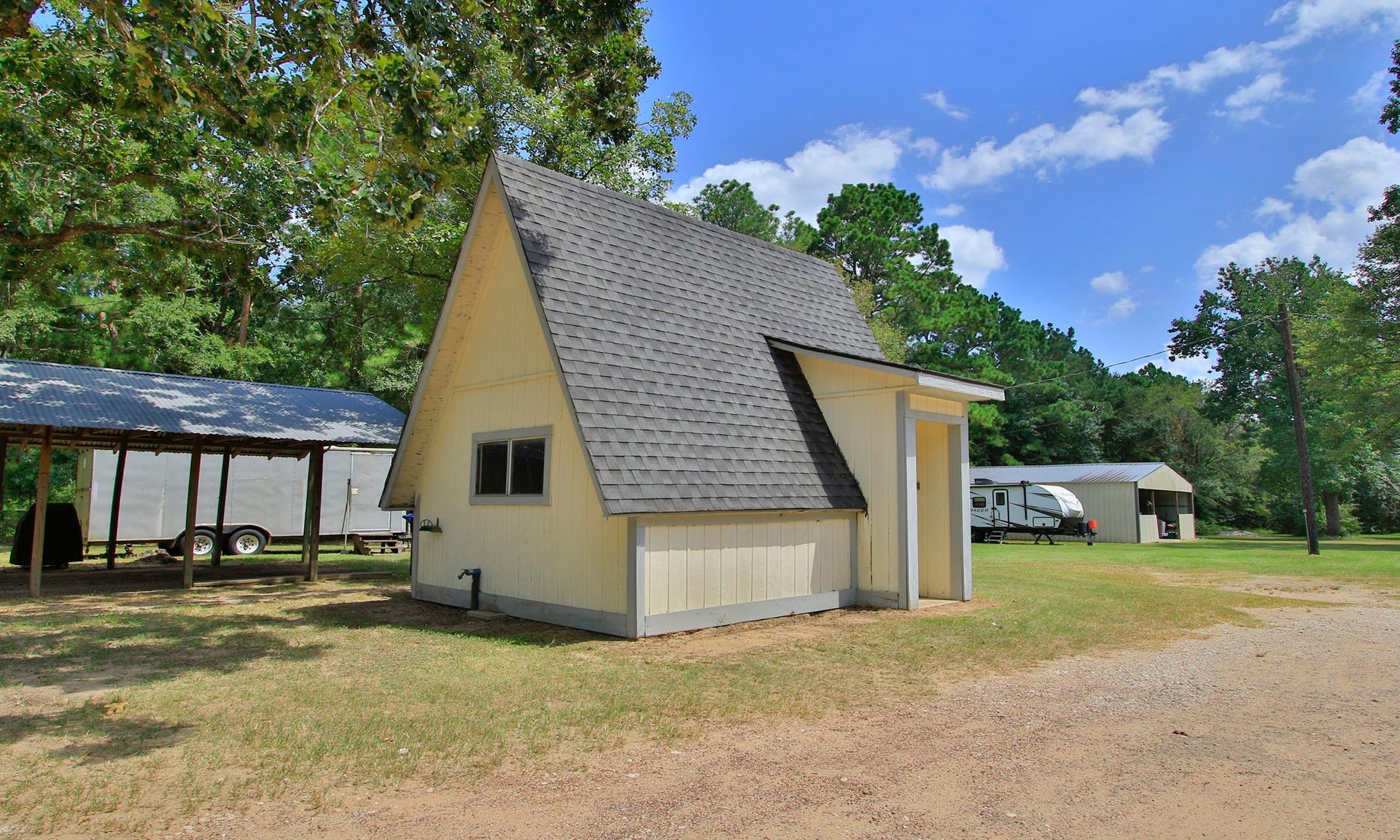 The property also includes a dedicated well house with additional space for tools, equipment, and storage.
