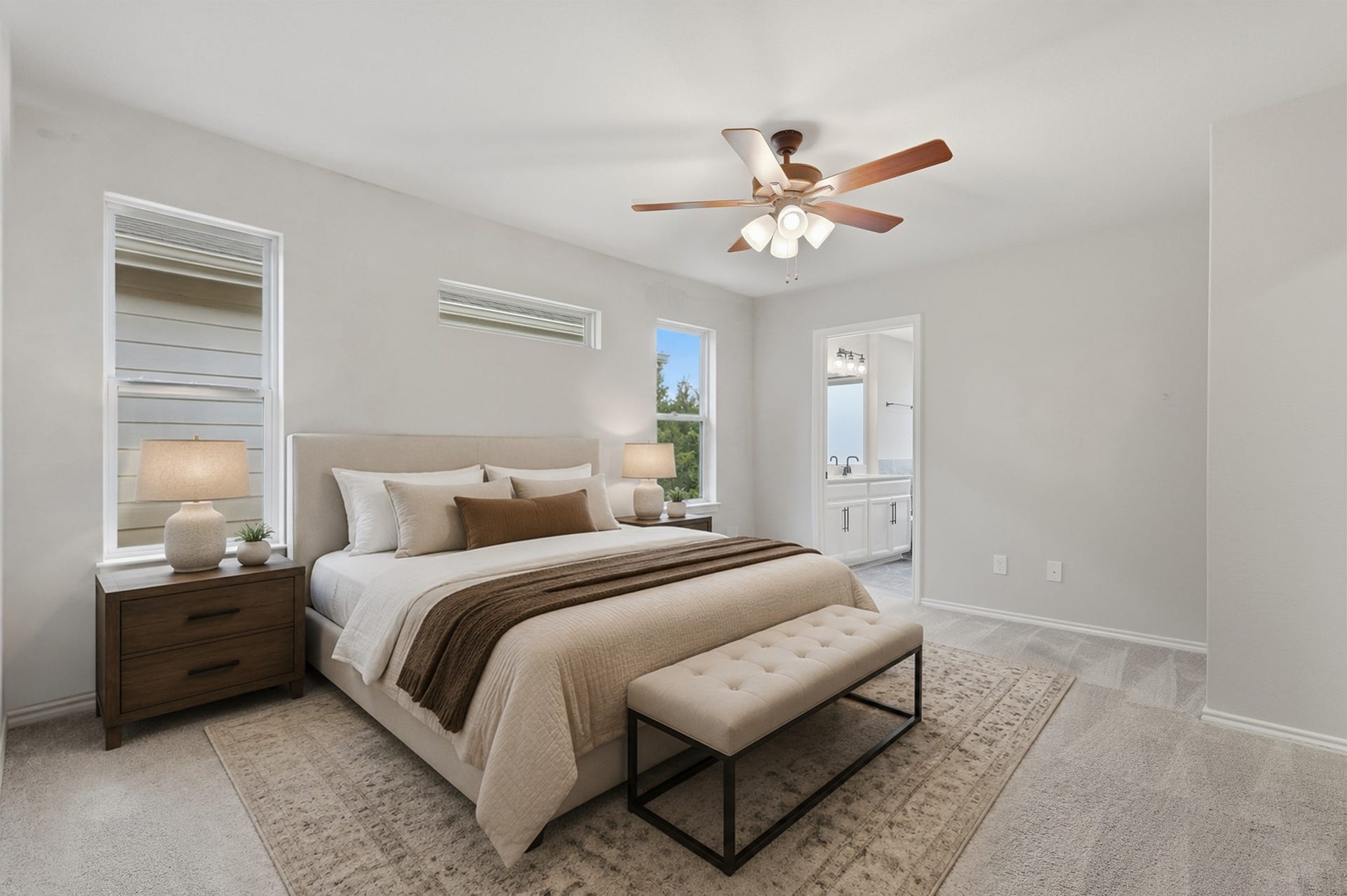 4028 Starbright Street, Houston, TX 77018 Bright primary bedroom with plush neutral carpeting, multiple windows for natural light, a ceiling fan, and direct access to the en-suite bath.**Virtually staged
