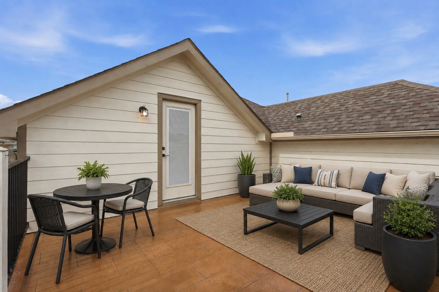 4028 Starbright Street, Houston, TX 77018 This upper-level terrace features tiled flooring, horizontal siding, and a glass-paneled door.