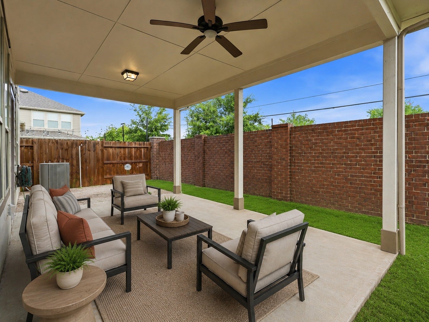 4028 Starbright Street, Houston, TX 77018 Covered concrete patio opens to a private backyard setting framed by a brick accent wall for complete privacy.**Virtually staged