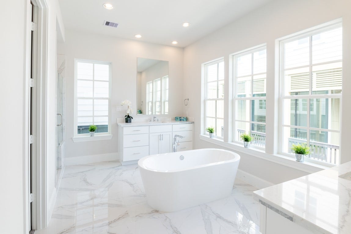 Bathed in glorious natural light and separate vanities.
