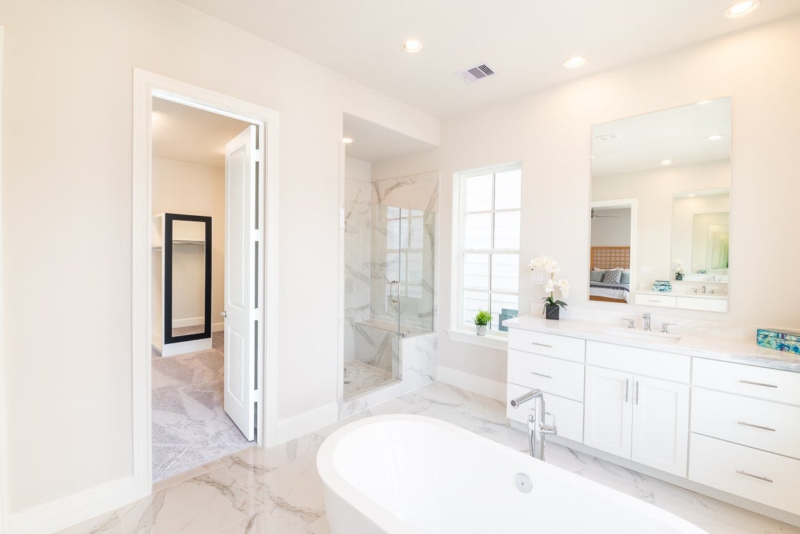 Primary bath is so spacious and love the huge shower with bench seat.