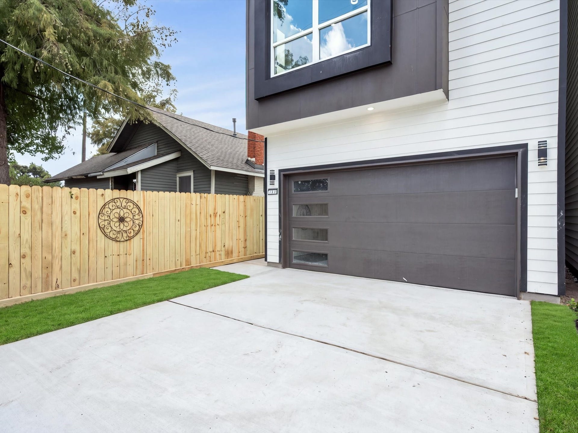 120 Estelle Street, Houston, TX 77003 Sleek exterior finishes complement the homes modern design, with an attached private 2-car garage adding convenience.