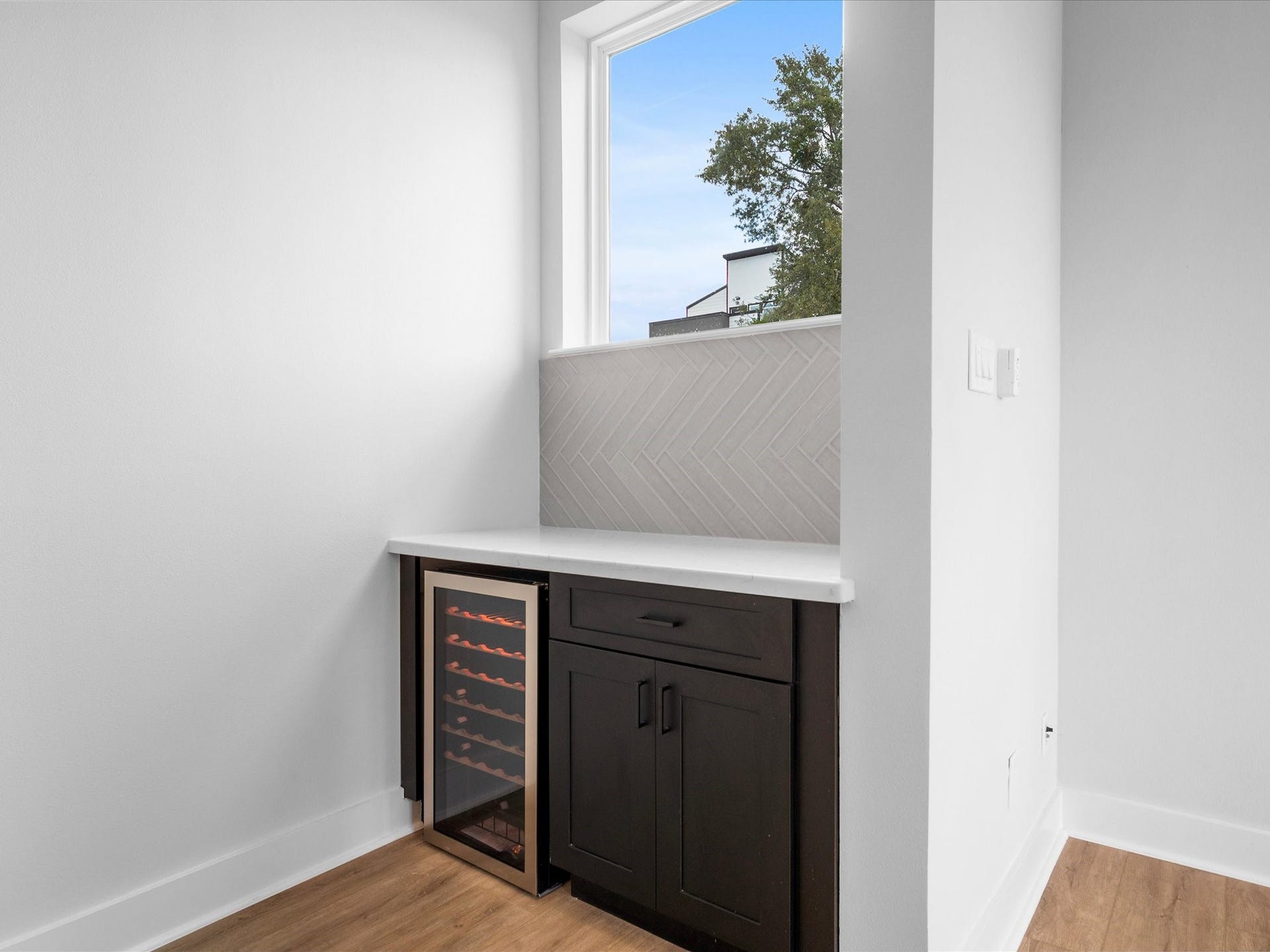 120 Estelle Street, Houston, TX 77003 A stylish dry bar with a beverage fridge creates the perfect spot for entertaining.