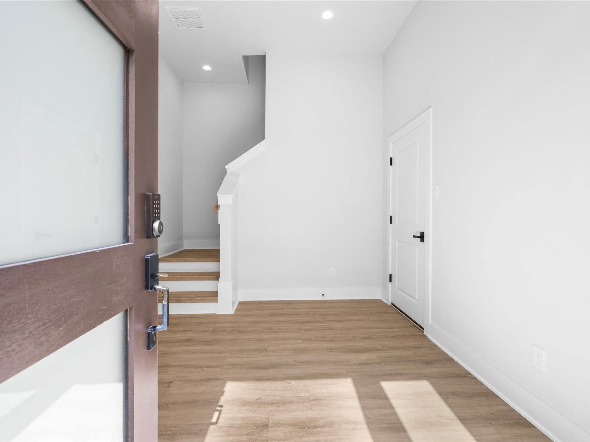 120 Estelle Street, Houston, TX 77003 A welcoming entry introduces the home's contemporary style, setting the stage for thoughtfully designed interiors and elevated modern finishes throughout.
