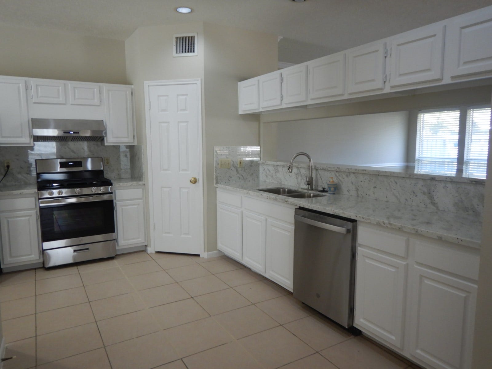 4518 Westray Drive, Missouri City, TX 77459 Updated kitchen with new granite counter tops and painted cabinetry