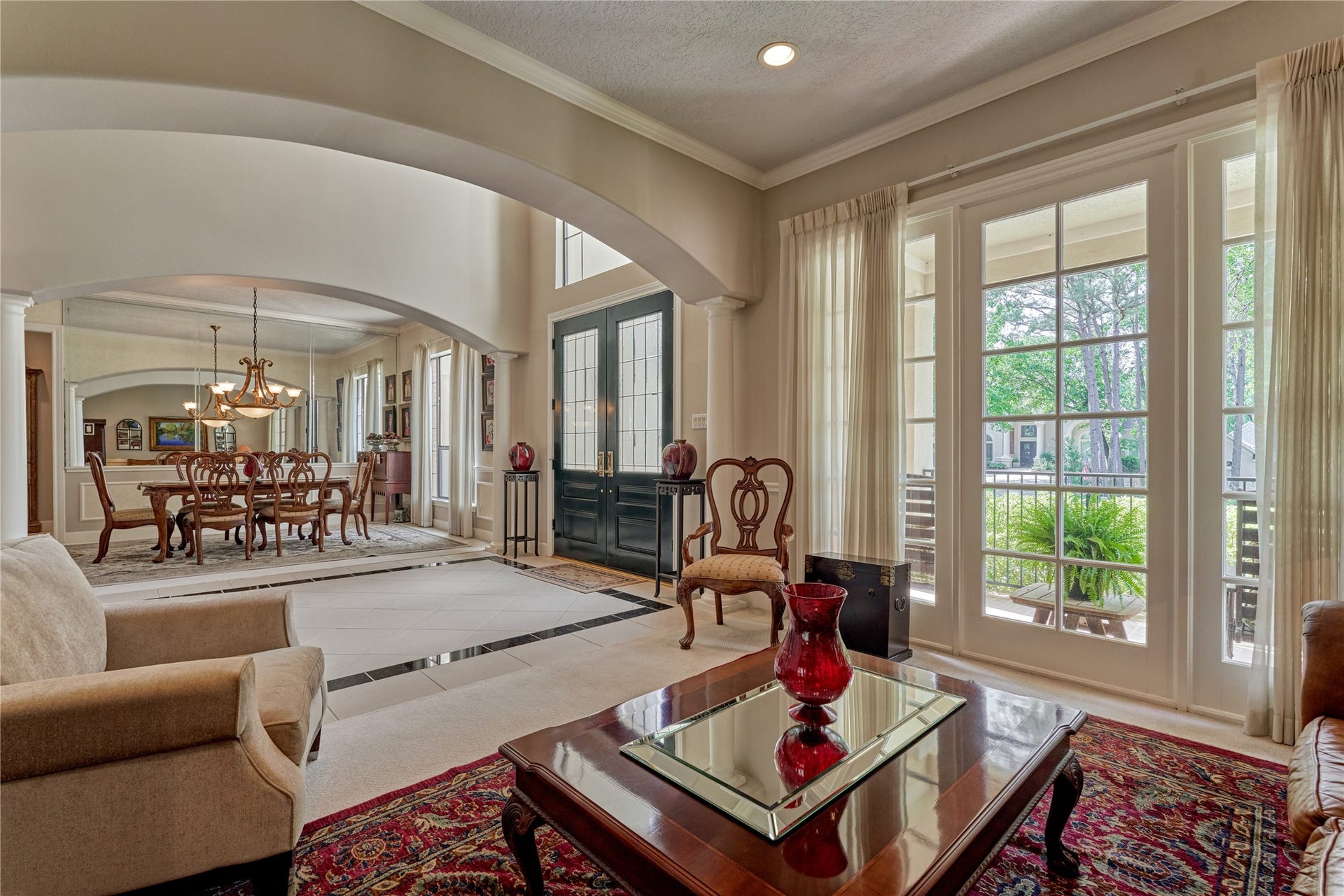 3073 Bentwater Drive, Montgomery, TX 77356 The formal living room offers another inviting space for gatherings, providing an ideal setting for hosting book club or intimate conversations among friends.