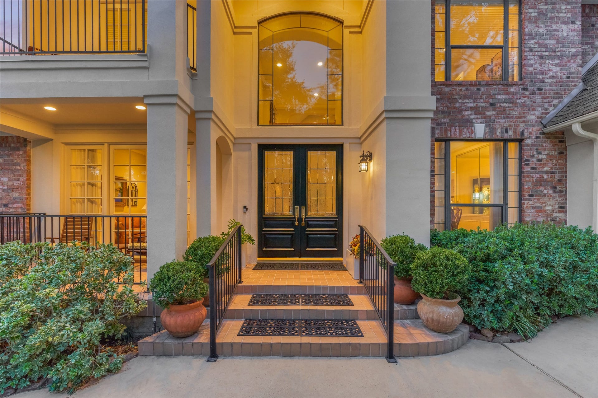 3073 Bentwater Drive, Montgomery, TX 77356 The stately double door entrance with beautiful foliage and landscaping adds to the luxurious welcoming appeal of this home.