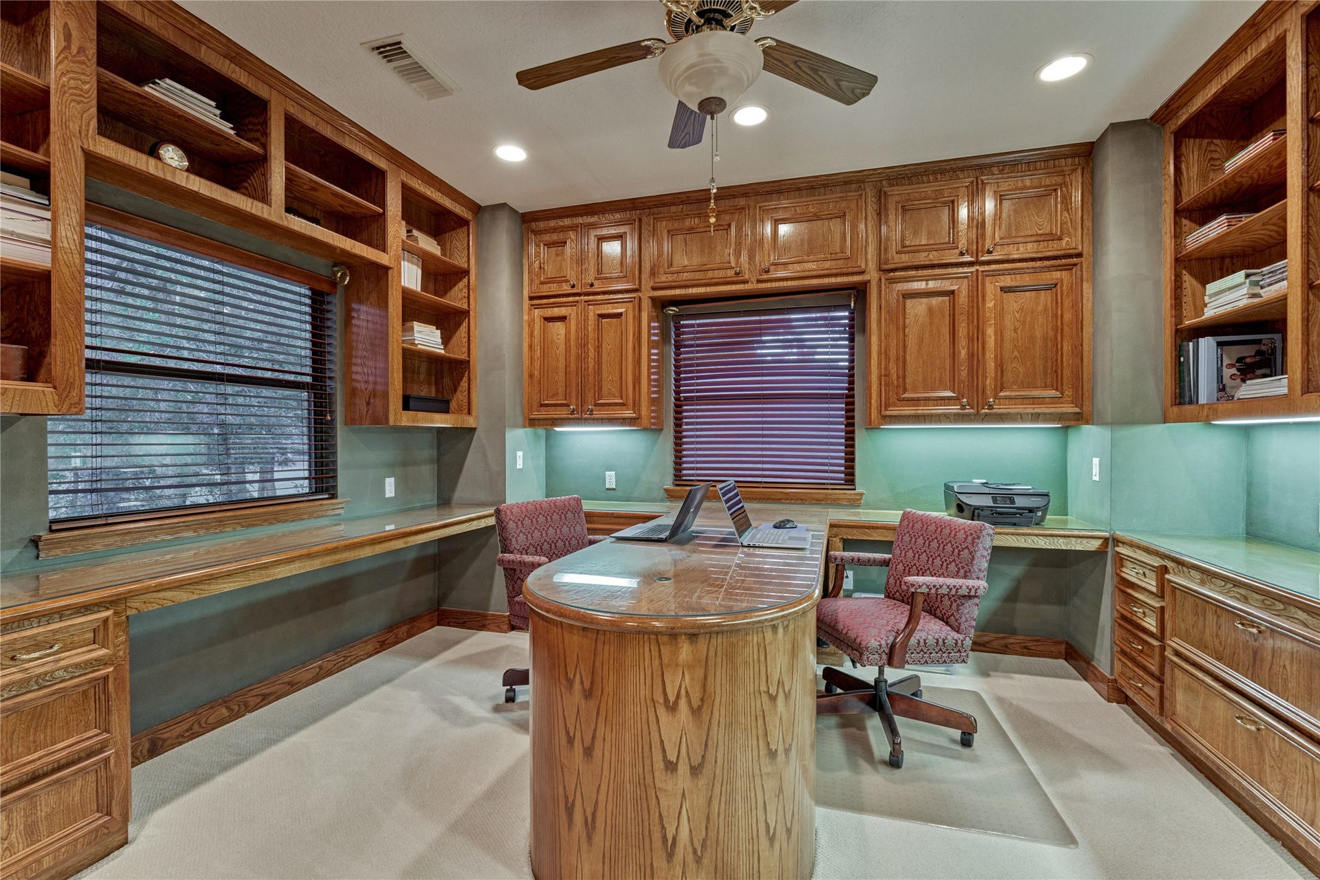 3073 Bentwater Drive, Montgomery, TX 77356 Rich wood cabinetry provides abundant storage in the handsome study.