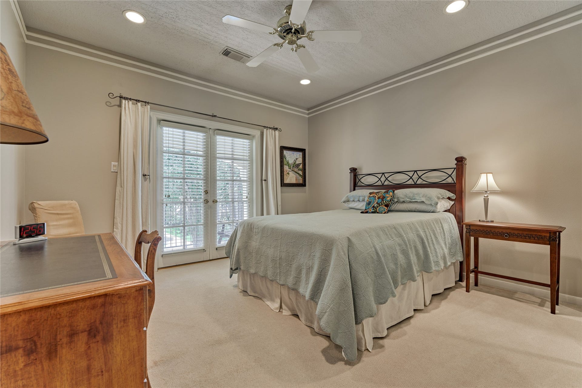 3073 Bentwater Drive, Montgomery, TX 77356 Bedroom #3 features French doors that open to a balcony overlooking the front yard.