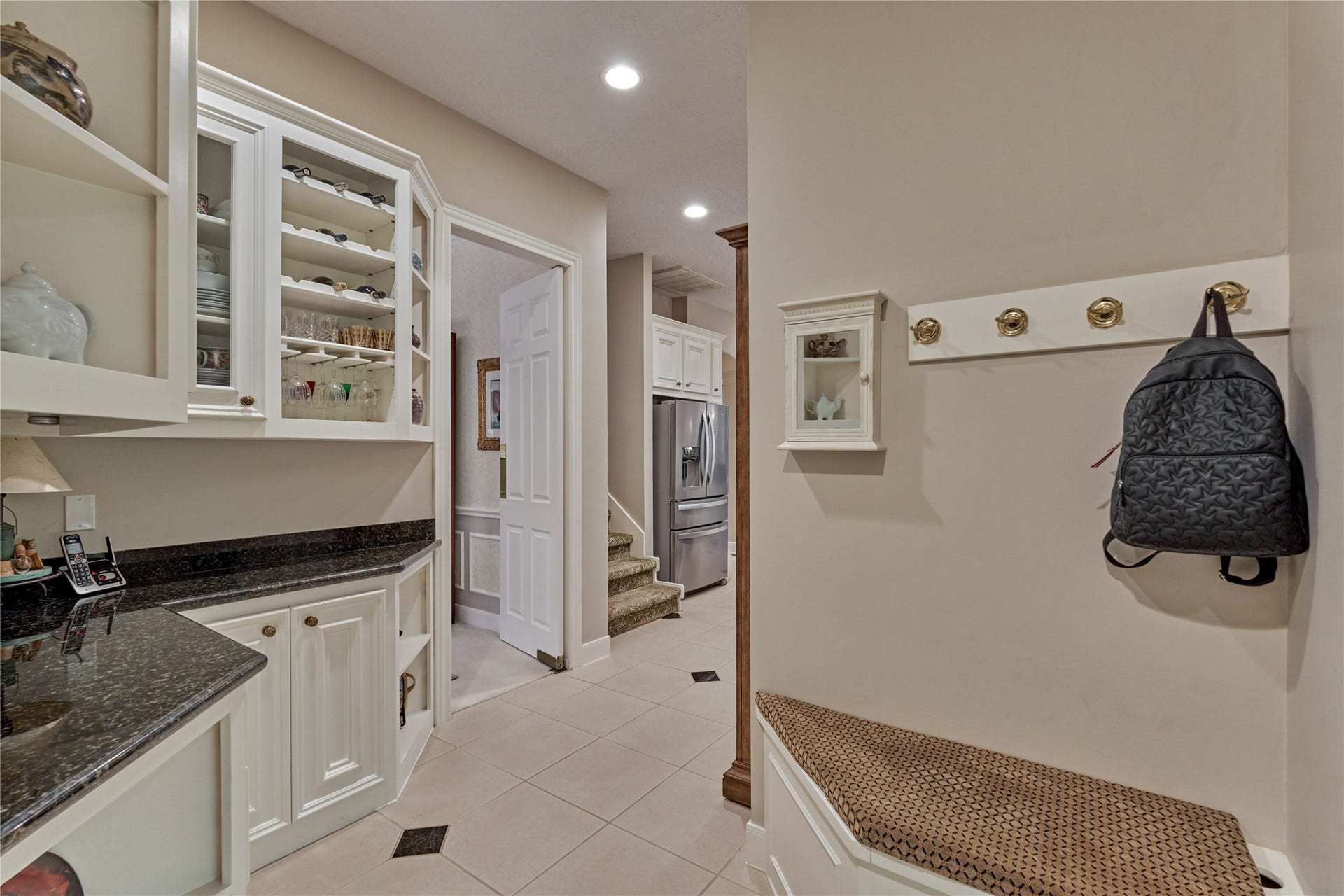 3073 Bentwater Drive, Montgomery, TX 77356 Mud area just off garage entrance leads to butler pantry and kitchen. Stairs to second level are between dining room and kitchen.