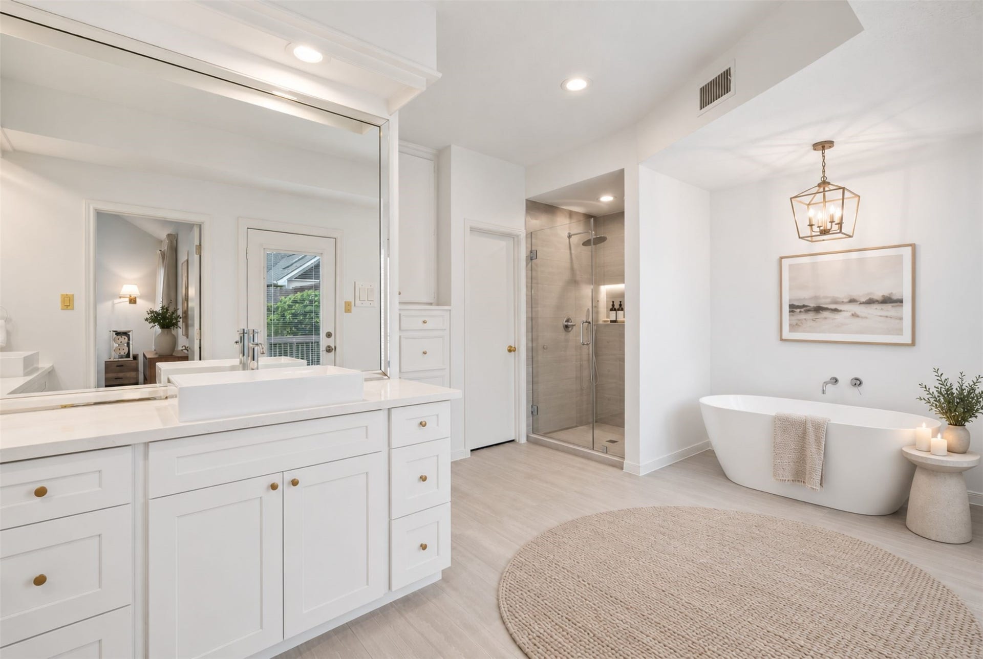 12219 Ravenmoor Drive, Houston, TX 77077 Indulge in a spa-like retreat in this spacious bathroom, featuring a sleek glass-enclosed shower, an elegant freestanding soaking tub, and expansive windows that fill the space with natural light. (Virtually Staged)