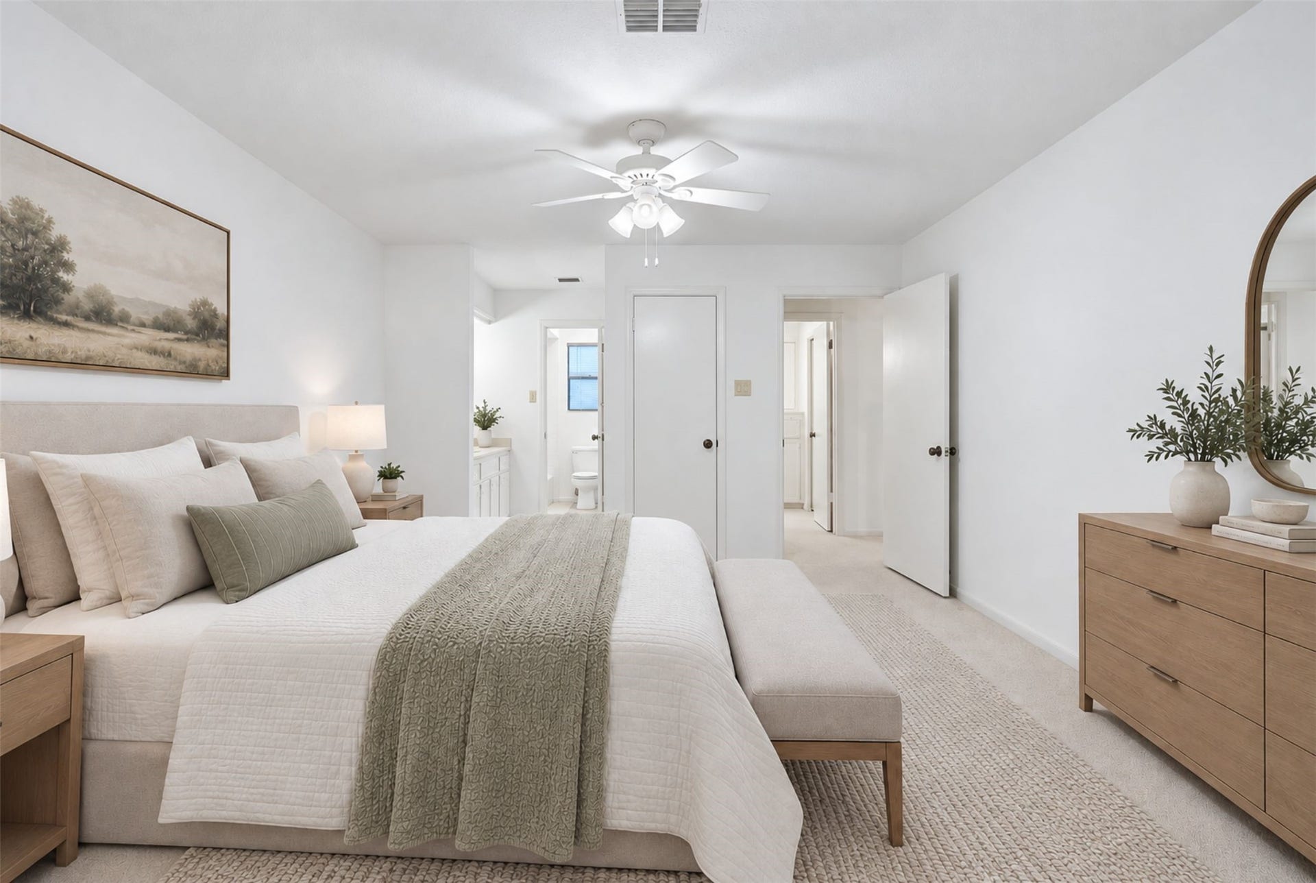 12219 Ravenmoor Drive, Houston, TX 77077 A beautiful bedroom exuding tranquility with neutral tones, elegant furnishings, and abundant natural light. (Virtual Staging)