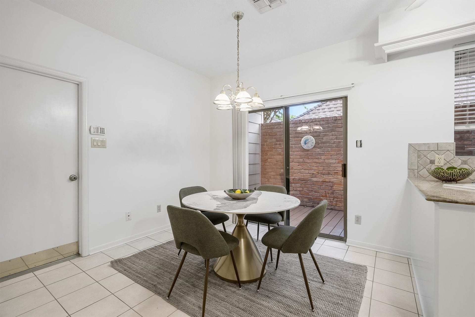 12219 Ravenmoor Drive, Houston, TX 77077 Bright dining area featuring a sliding glass door leading to a private patio.