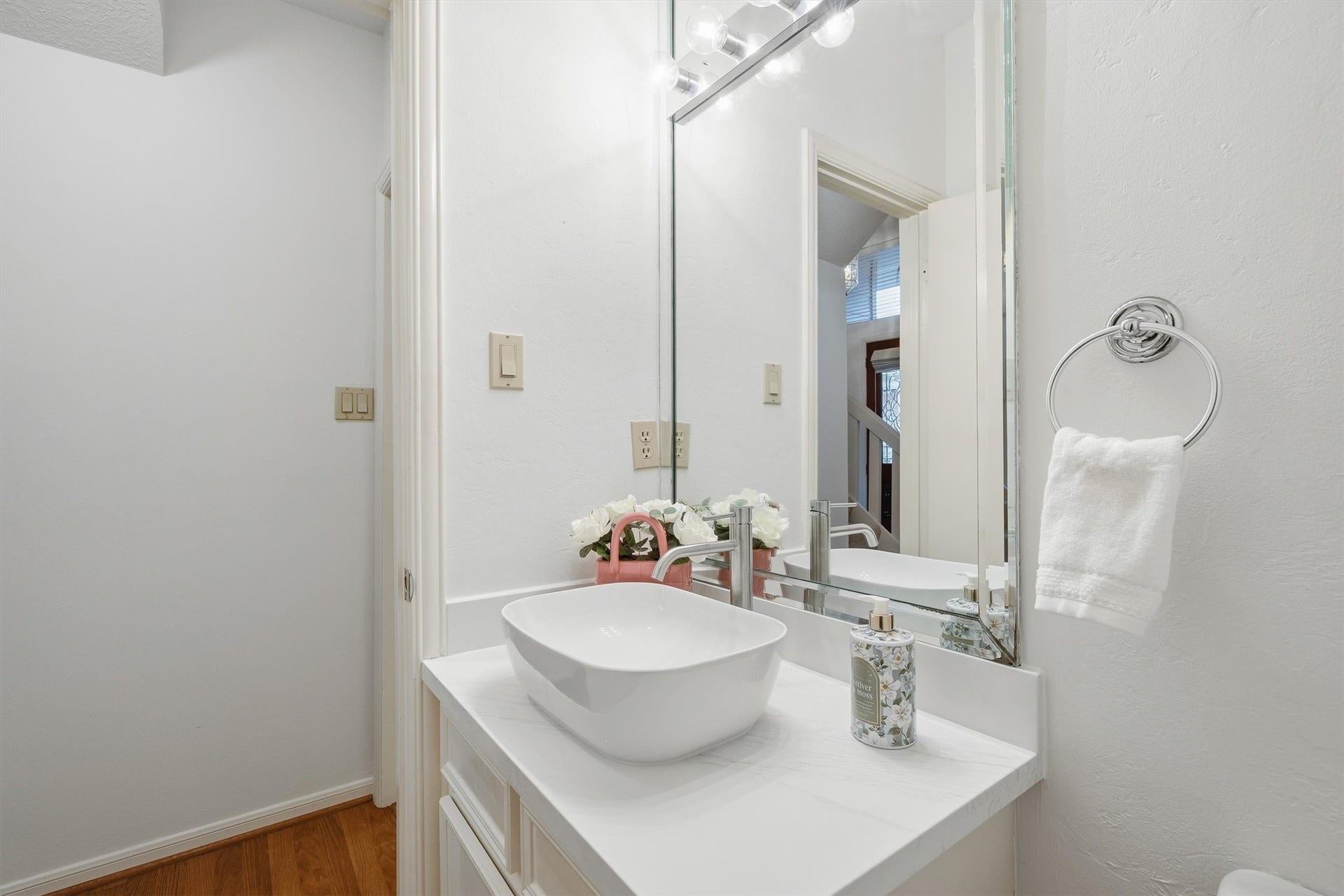 12219 Ravenmoor Drive, Houston, TX 77077 Chic half bath with a sleek vessel sink and modern fixtures, perfect for guests.