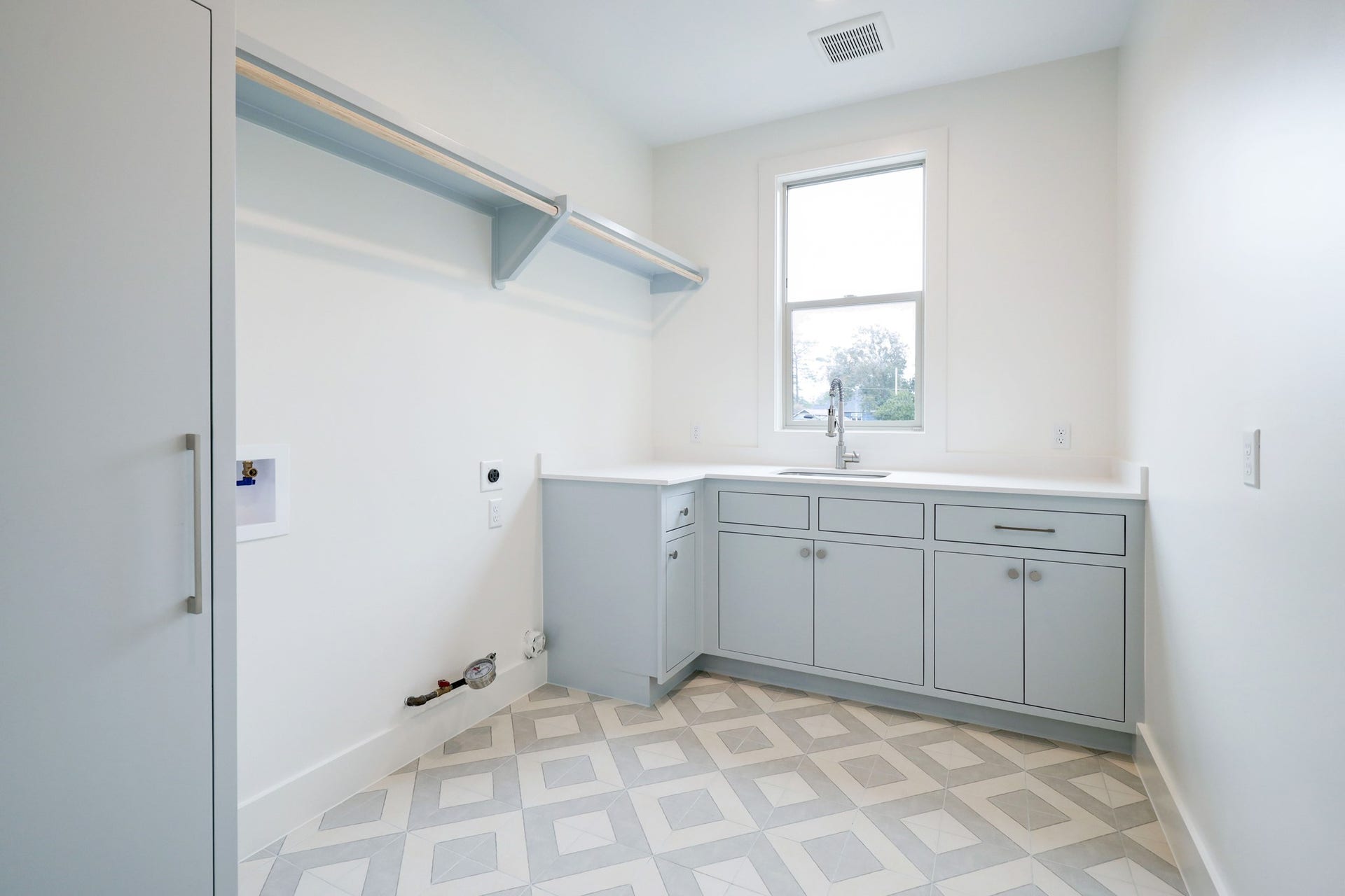 Utility room located on the second floor with sink and plenty of storage and counter space. *Previous Proiect*