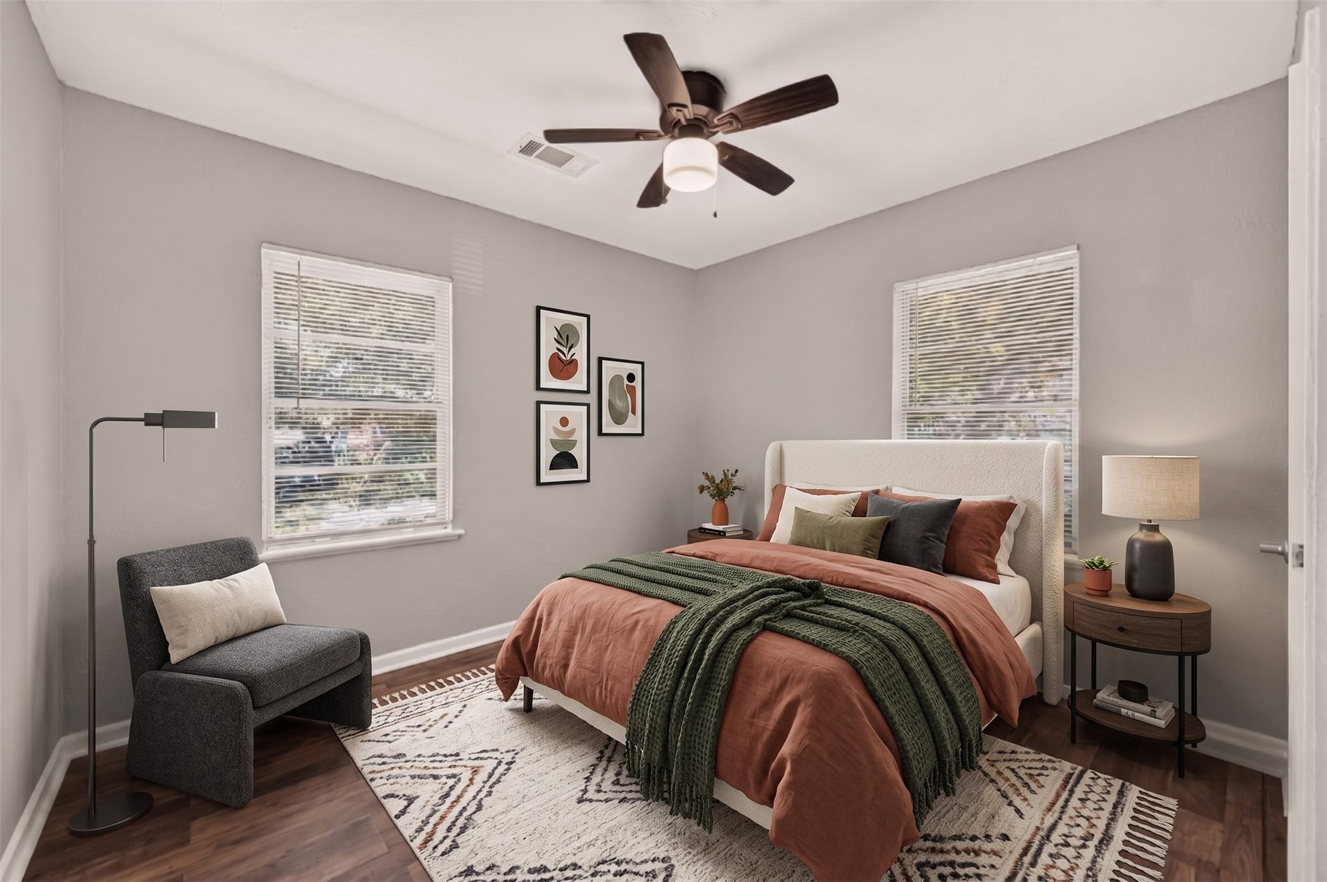 5935 Beldart Street, Houston, TX 77033 Bedroom 2 with windows on two walls and ceiling fan. (Virtually staged)