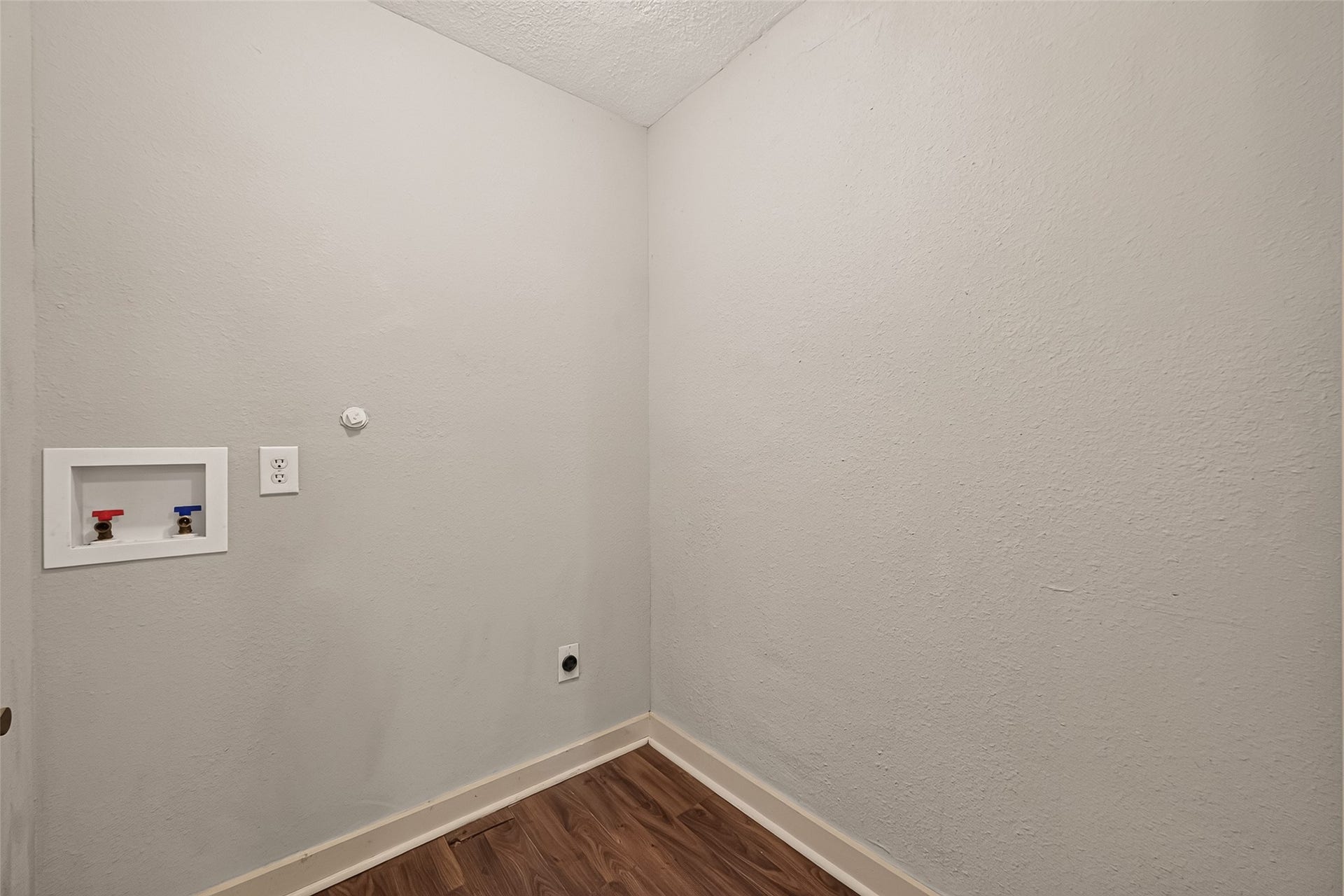 5935 Beldart Street, Houston, TX 77033 Utility room with washer and dryer connections.