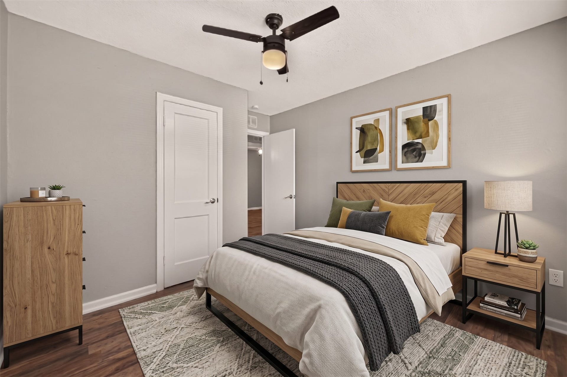 5935 Beldart Street, Houston, TX 77033 Bedroom 3 with ceiling fan and door to the hall. (Virtually staged)