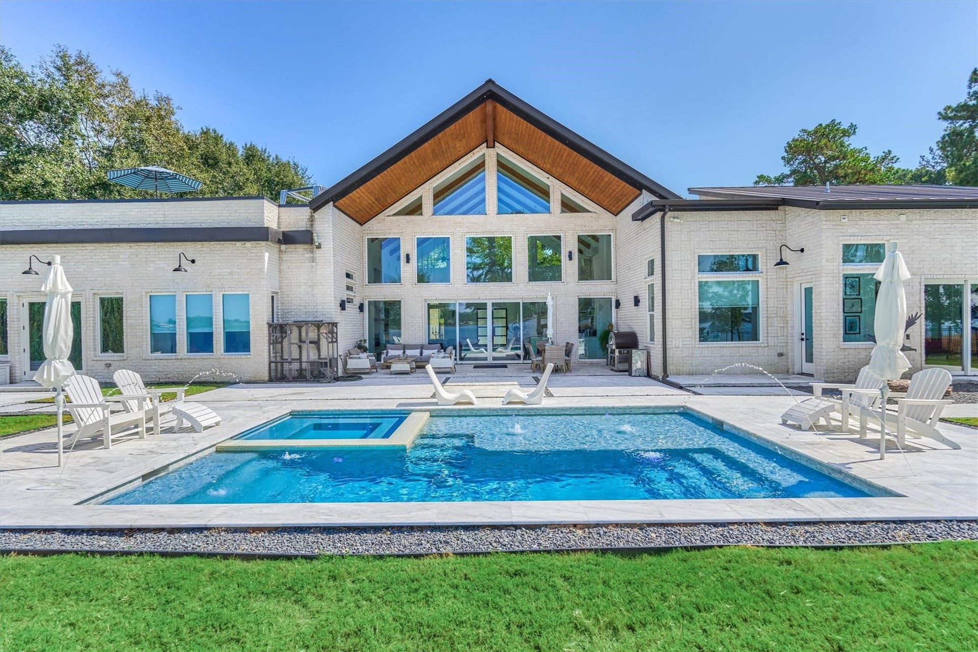 9228 Lake Conroe Drive, Conroe, TX 77304 44. A sparkling chloring pool and spa were expertly designed to also function as an exercise pool, offering both relaxation and an opportunity for active swimming against jets.