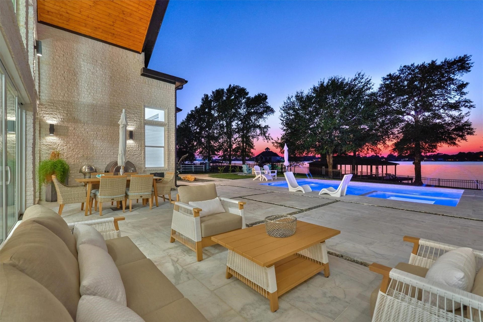 9228 Lake Conroe Drive, Conroe, TX 77304 46. Relax and enjoy evenings around the pool and lake where breathtaking sunsets create a perfect backdrop for unwinding or entertaining.