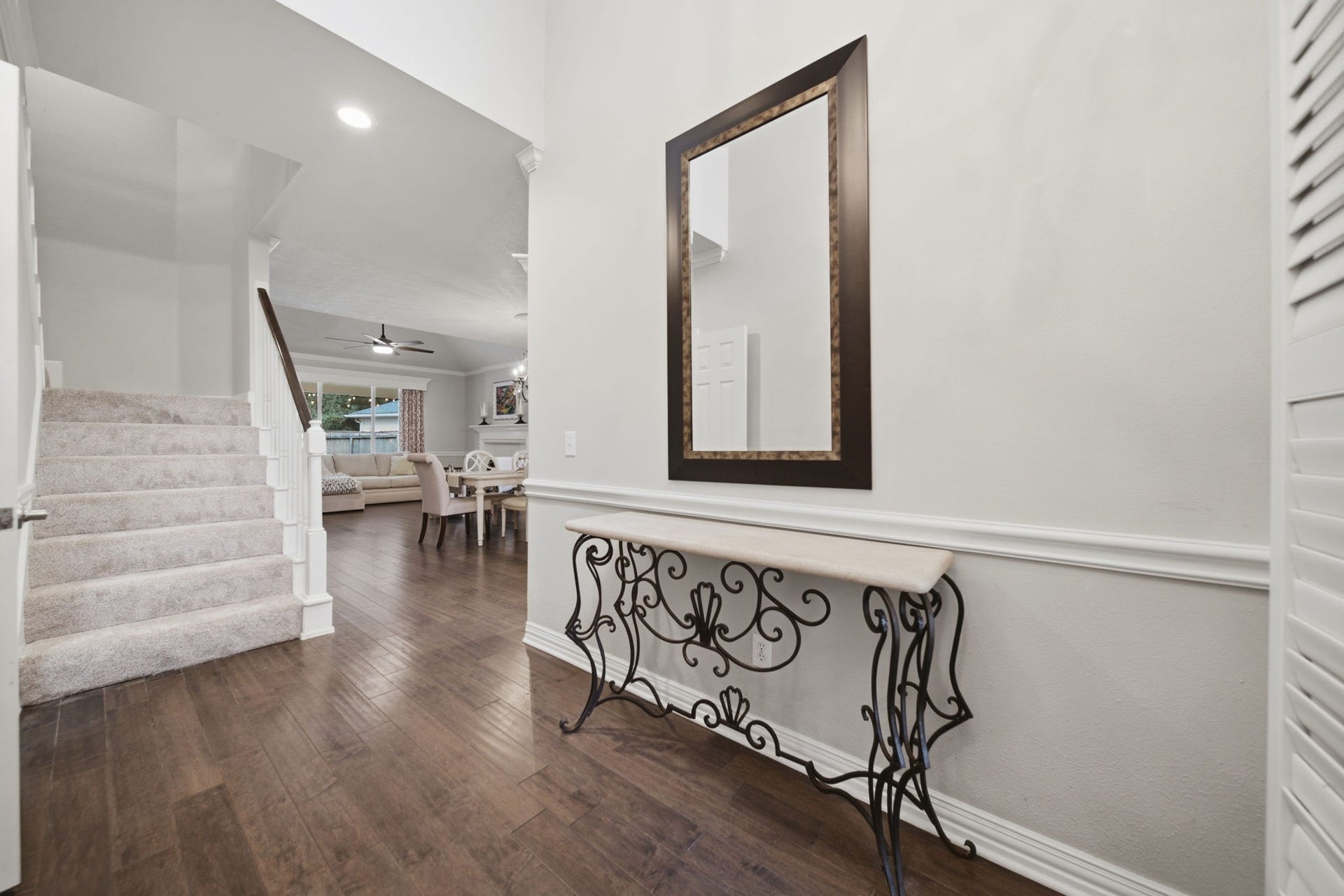 99 E Sterling Pond Circle, The Woodlands, TX 77382 This entry welcomes you inside. Check out the warm wood flooring in the living areas. The carpeting was just replaced in October 2026.
