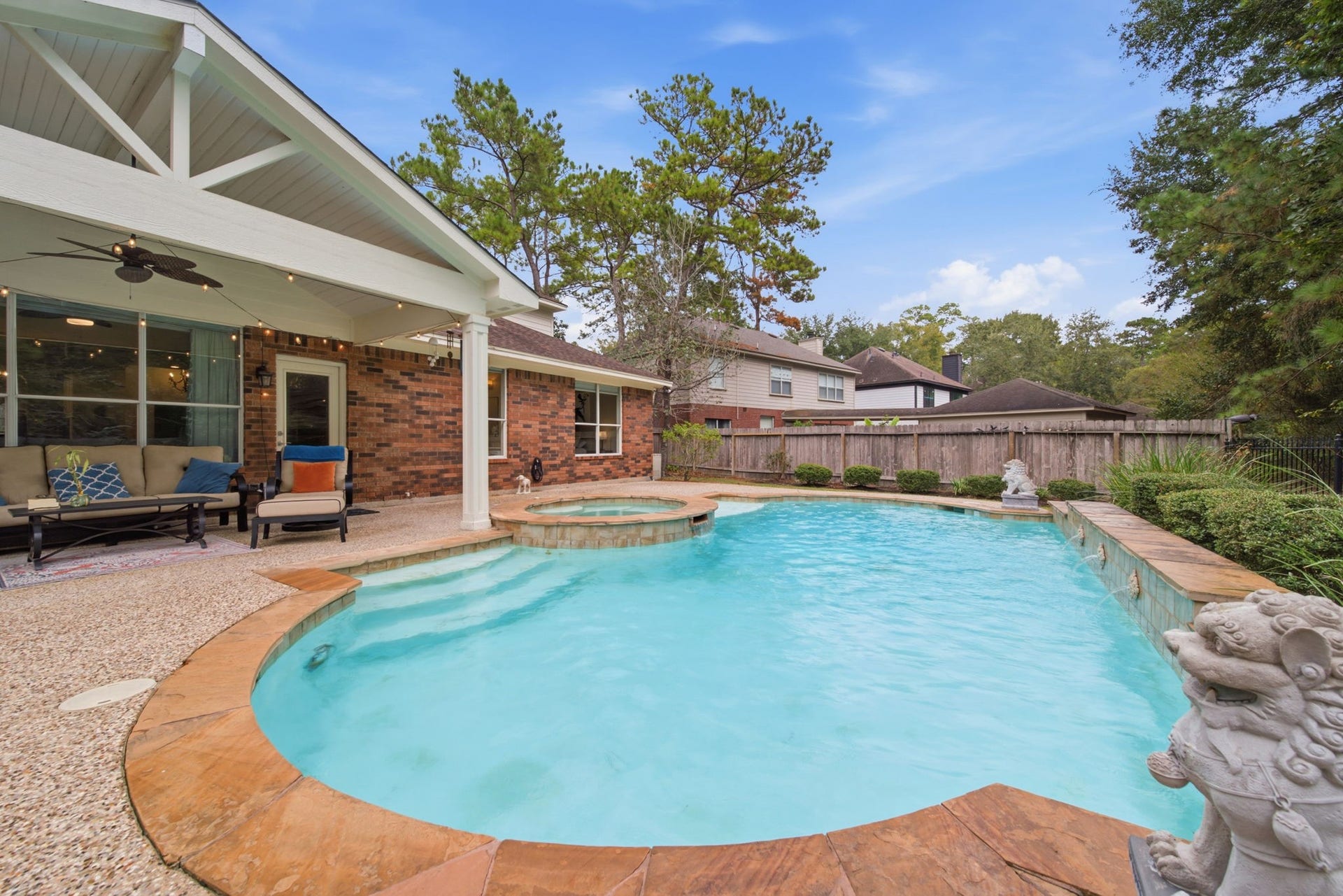 99 E Sterling Pond Circle, The Woodlands, TX 77382 This stunning backyard oasis features a sparkling pool with a spa, surrounded by lush greenery and a spacious covered patio perfect for entertaining. The best part is that it's on a true greenbelt. It's such a serene place to unwind!