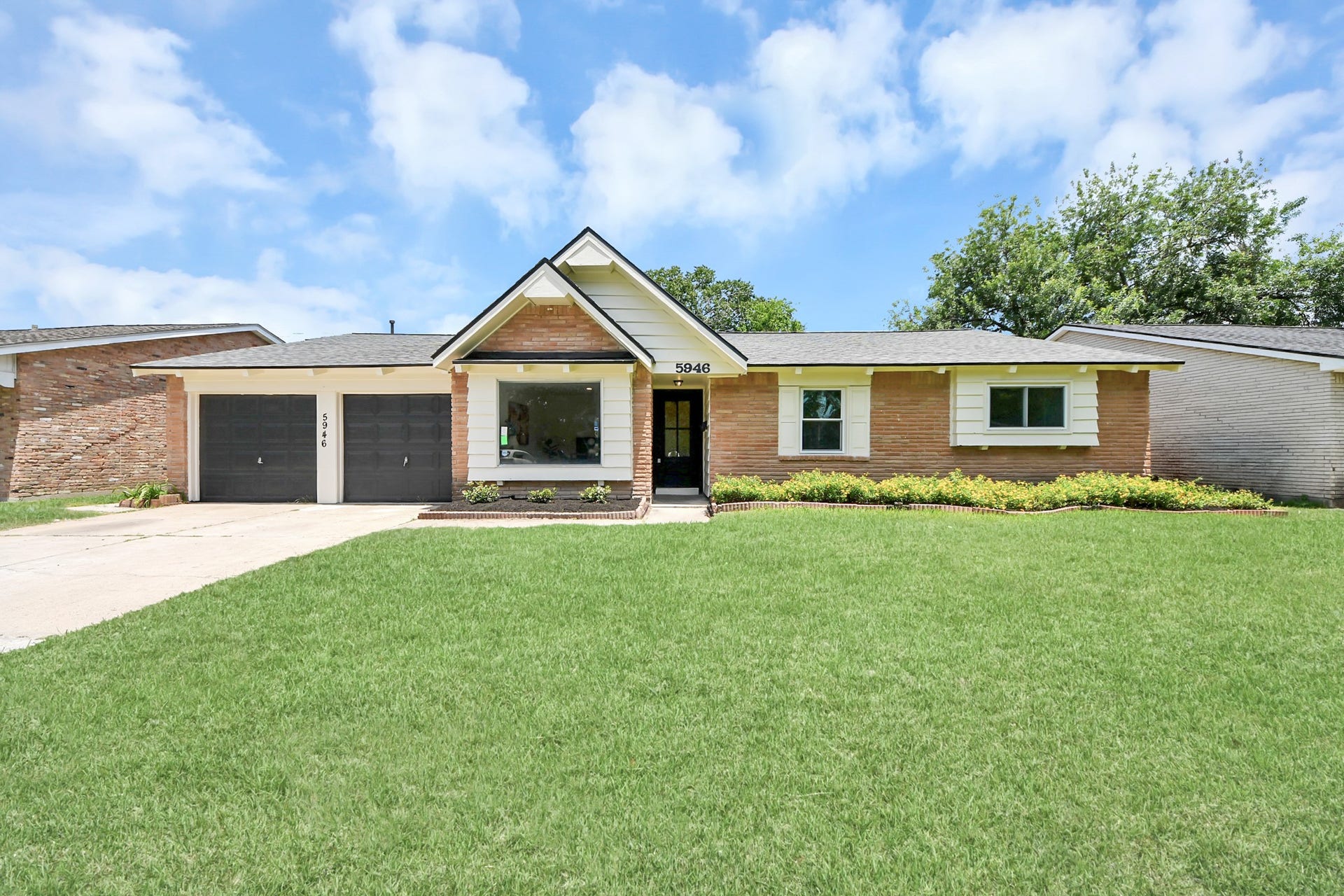 5946 Willowbend Boulevard, Houston, TX 77096 Beautifully updated exterior with fresh landscaping, expansive front lawn, and excellent curb appeal.