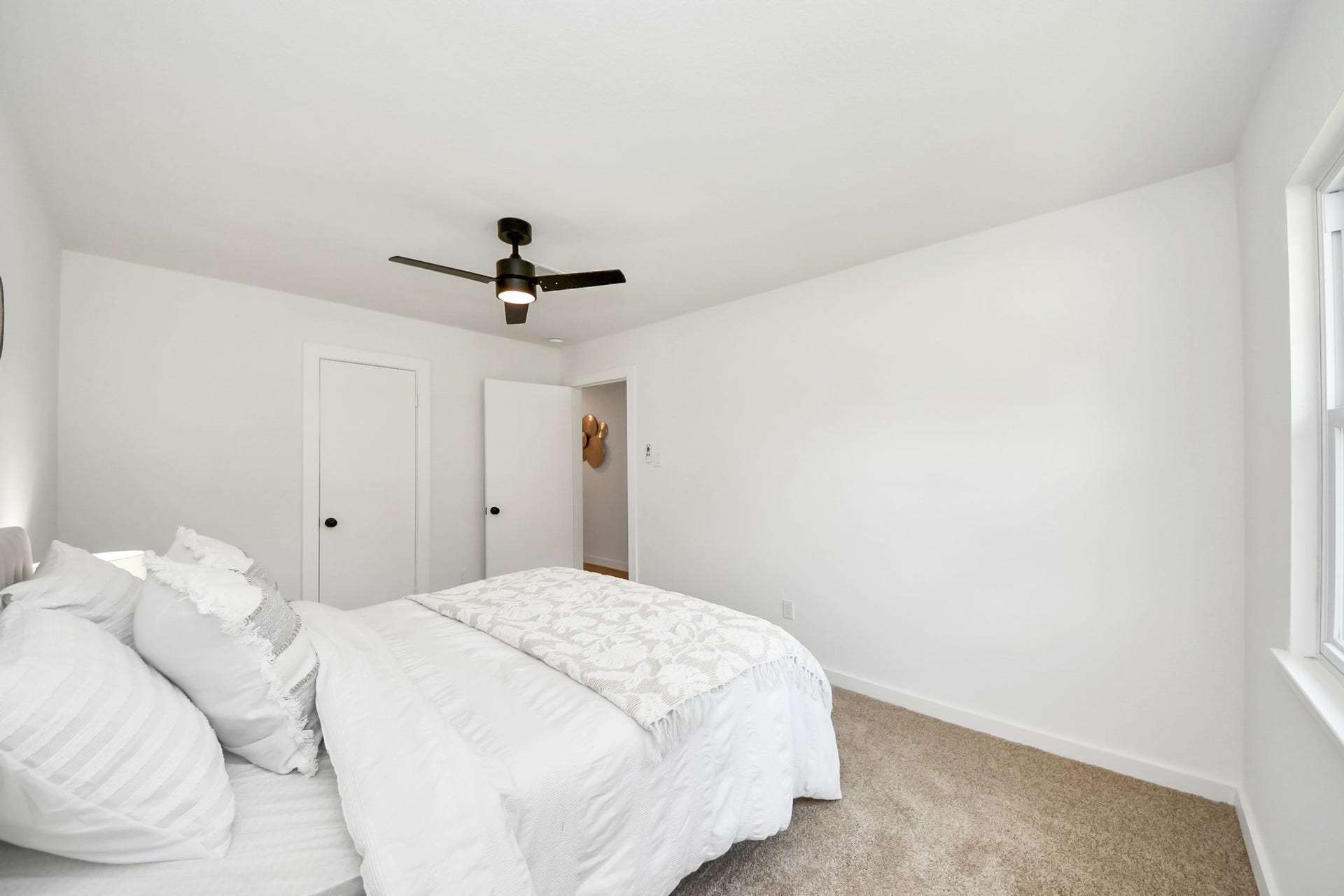 5946 Willowbend Boulevard, Houston, TX 77096 Spacious secondary bedroom with neutral finishes, updated flooring, and modern ceiling fan for year-round comfort.
