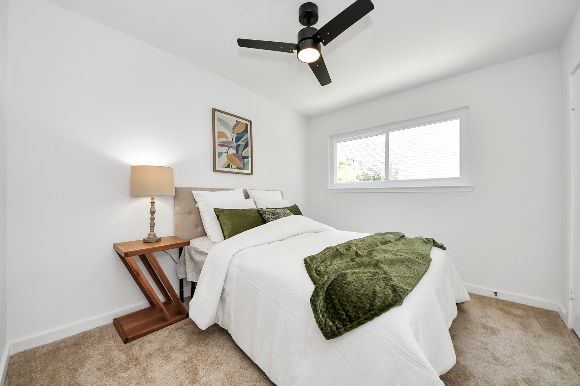 5946 Willowbend Boulevard, Houston, TX 77096 Bright guest bedroom featuring abundant natural light, modern finishes, and a clean contemporary feel.