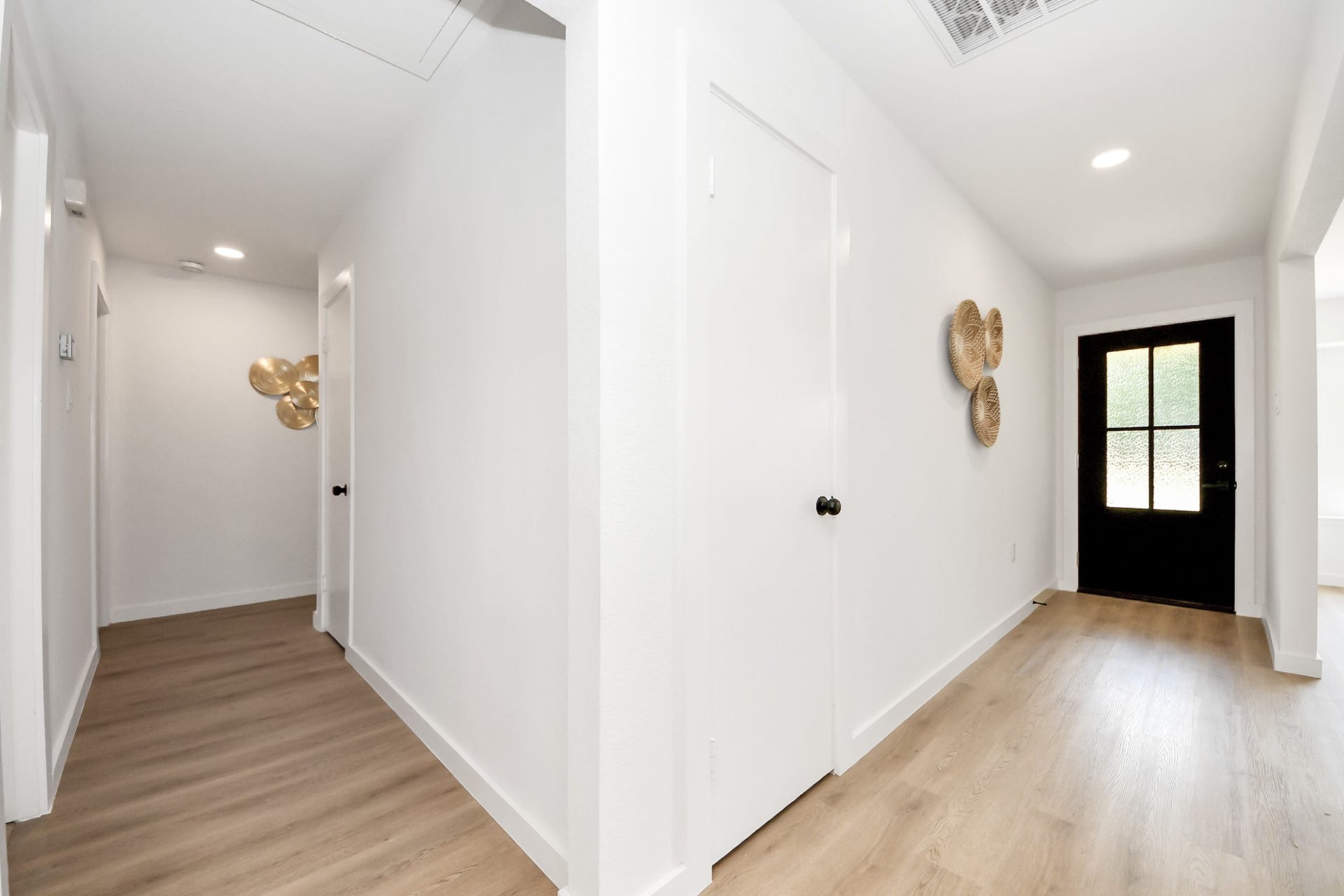 5946 Willowbend Boulevard, Houston, TX 77096 Wide interior hallway with modern finishes, updated flooring, and clean contemporary design throughout the home.