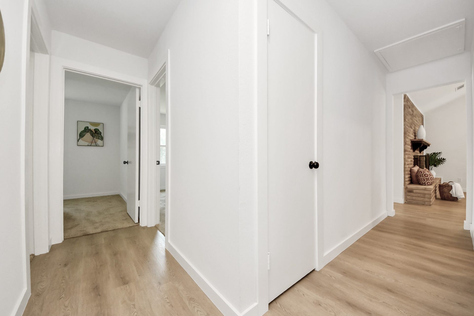 5946 Willowbend Boulevard, Houston, TX 77096 Bright interior hallway connecting the bedroom wing with modern finishes and functional flow.