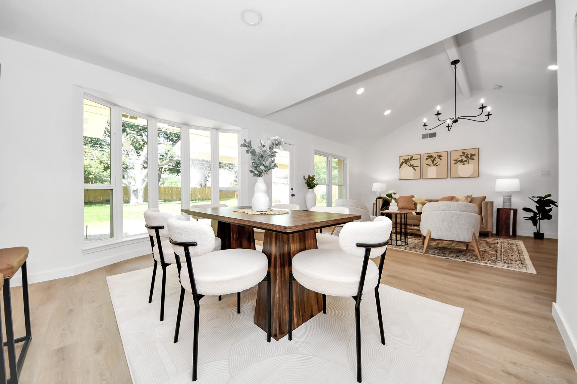 5946 Willowbend Boulevard, Houston, TX 77096 Light-filled dining space with vaulted ceilings, expansive windows, and elegant open-concept layout.