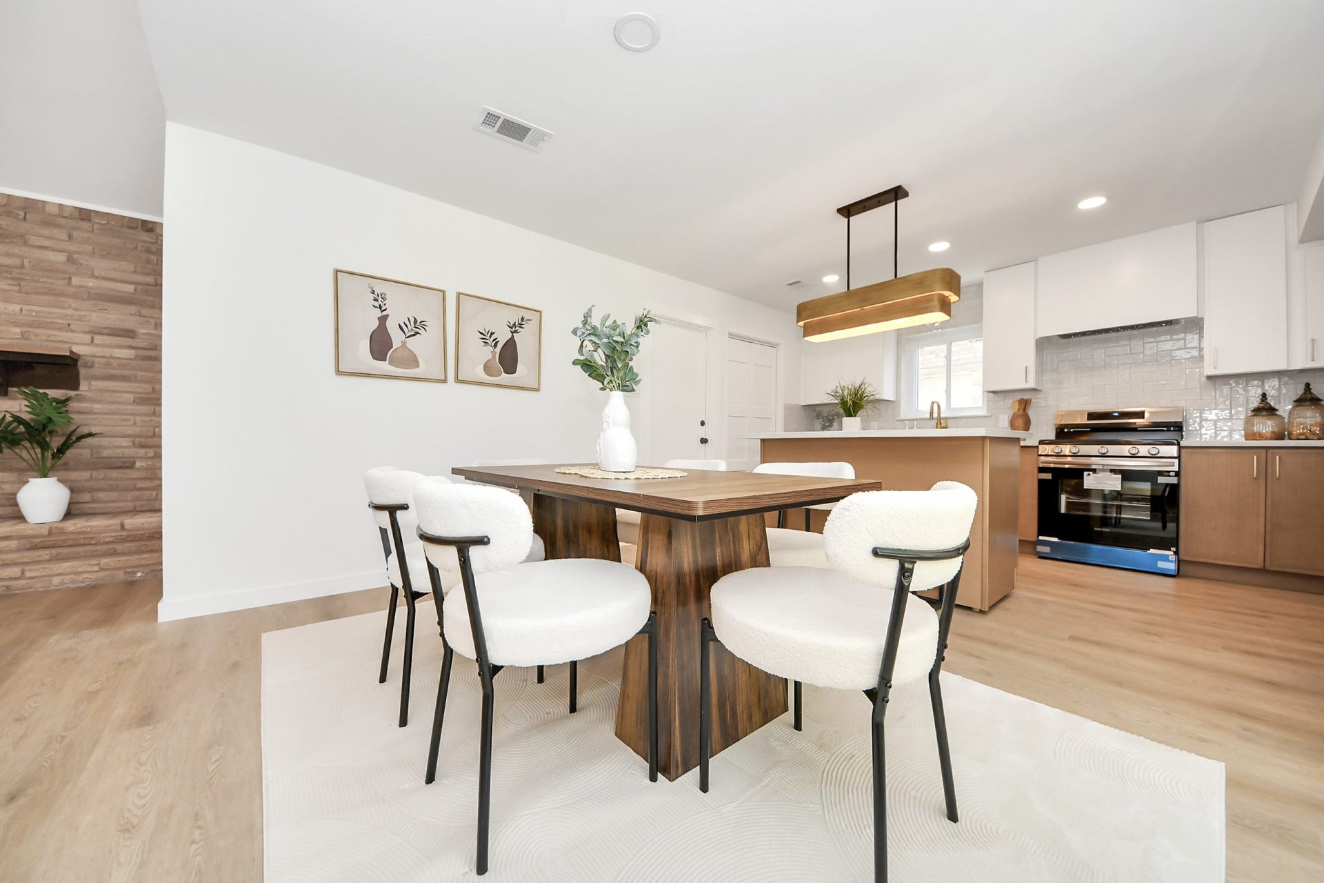 5946 Willowbend Boulevard, Houston, TX 77096 Spacious dining room perfect for hosting, highlighted by modern fixtures and seamless open-concept design.