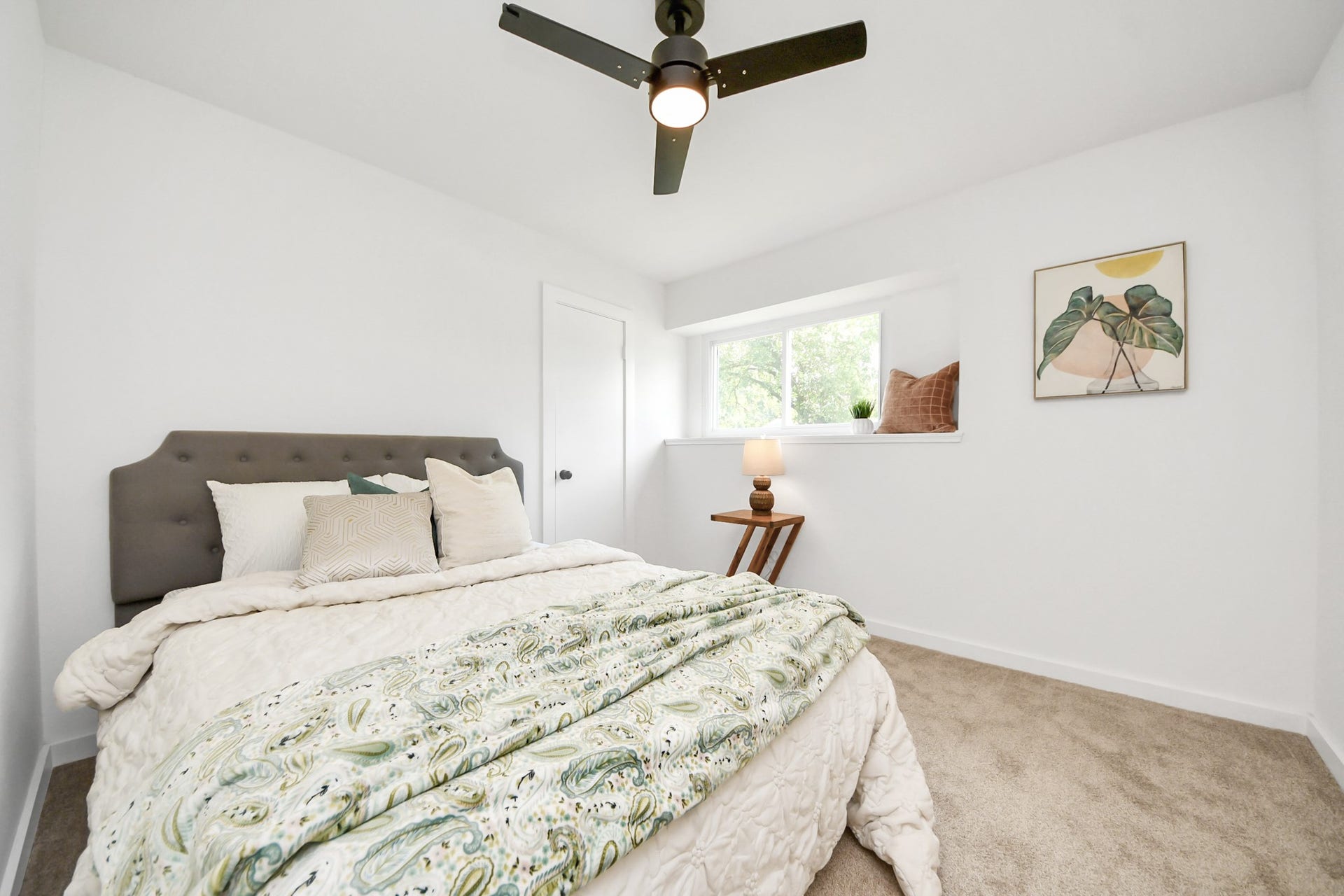5946 Willowbend Boulevard, Houston, TX 77096 Spacious secondary bedroom with updated flooring, modern ceiling fan, and abundant natural light.