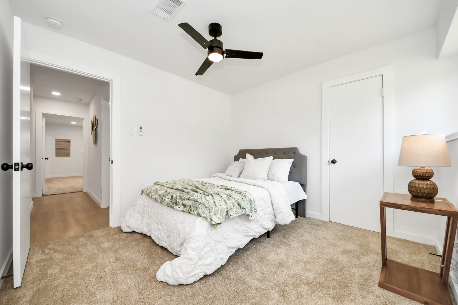 5946 Willowbend Boulevard, Houston, TX 77096 Large guest bedroom offering a functional layout, modern finishes, and relaxing neutral tones.