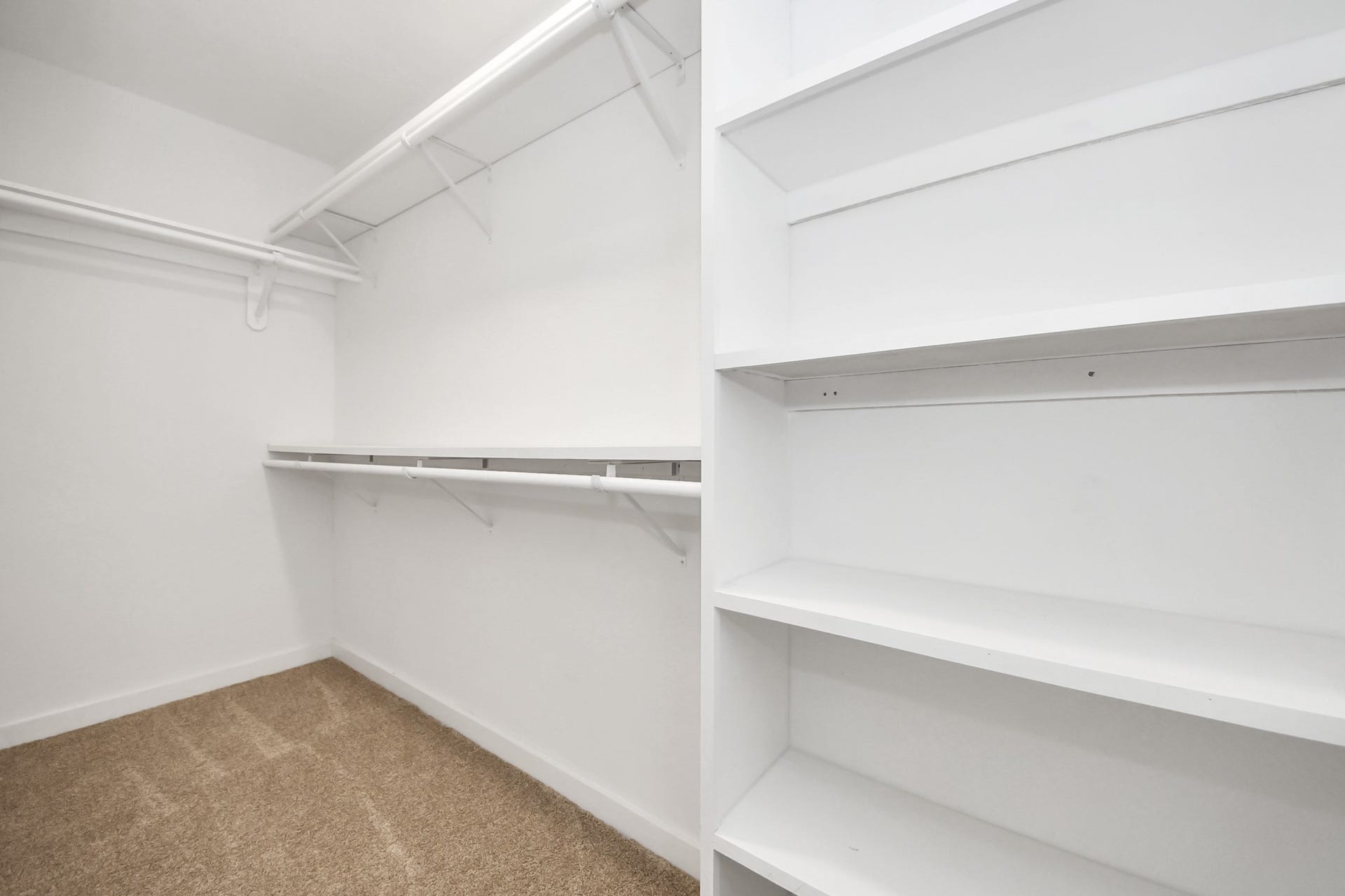 5946 Willowbend Boulevard, Houston, TX 77096 Massive walk-in closet with custom built-in shelving and abundant storage space.