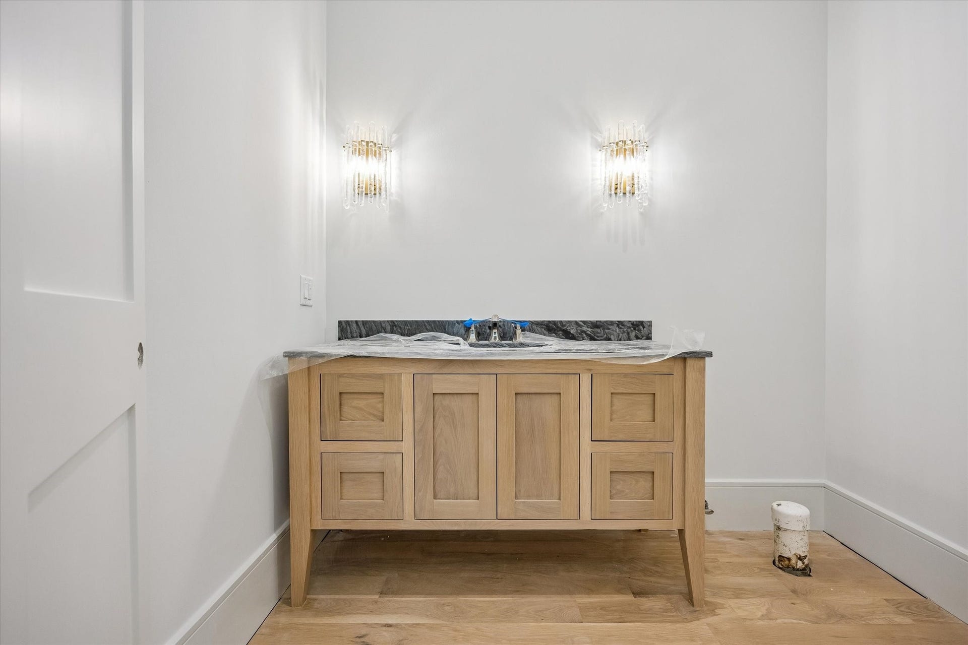 6011 Stones Throw Road, Houston, TX 77057 First-floor powder room features stylish finishes.