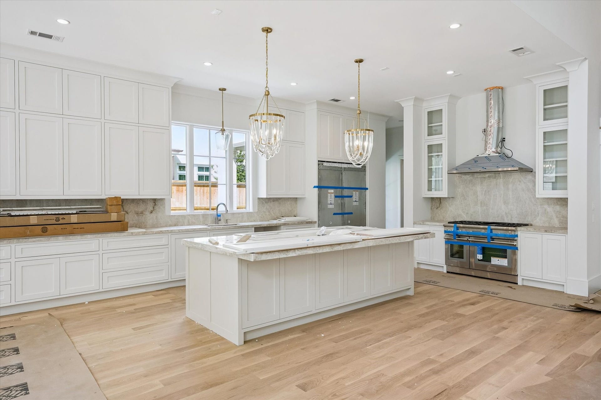 6011 Stones Throw Road, Houston, TX 77057 Kitchen features a premium Thermador appliance package, including double ovens and a built-in refrigerator.
