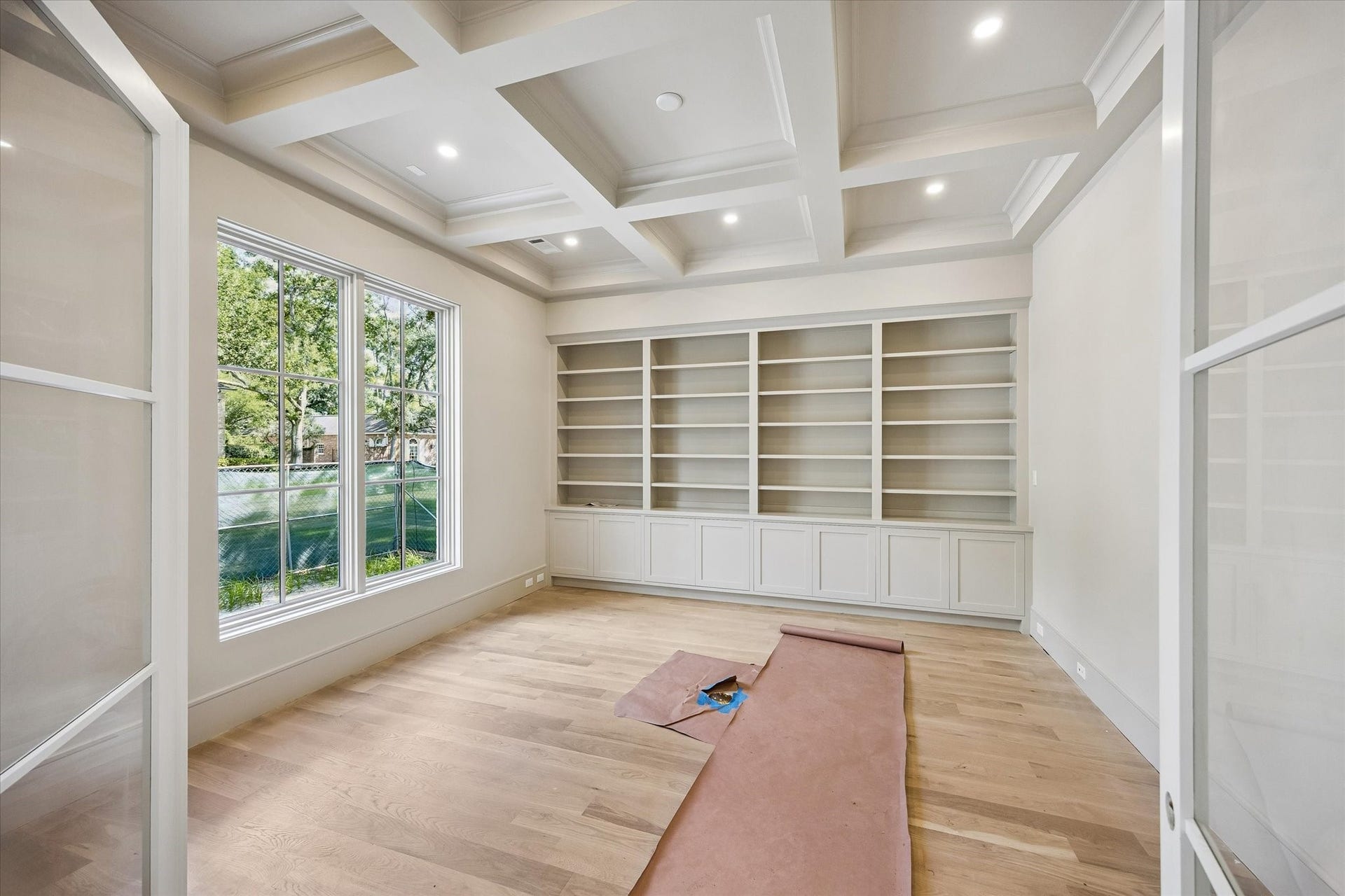 6011 Stones Throw Road, Houston, TX 77057 First-floor study/office features floor-to-ceiling custom built-ins, creating a sophisticated and functional workspace.