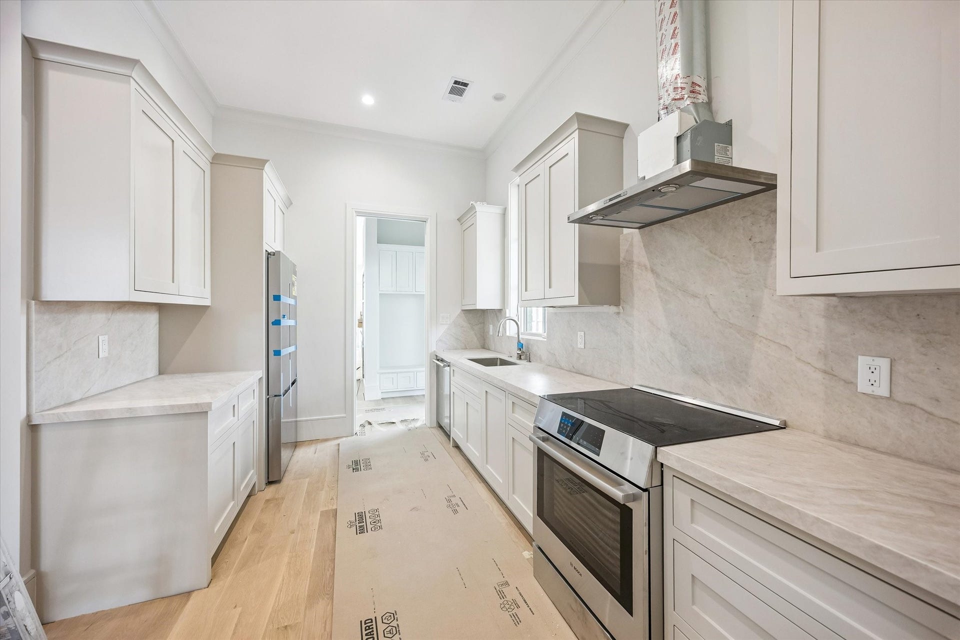 6011 Stones Throw Road, Houston, TX 77057 Scullery kitchen provides additional prep space, ample cabinetry, and convenient storage.