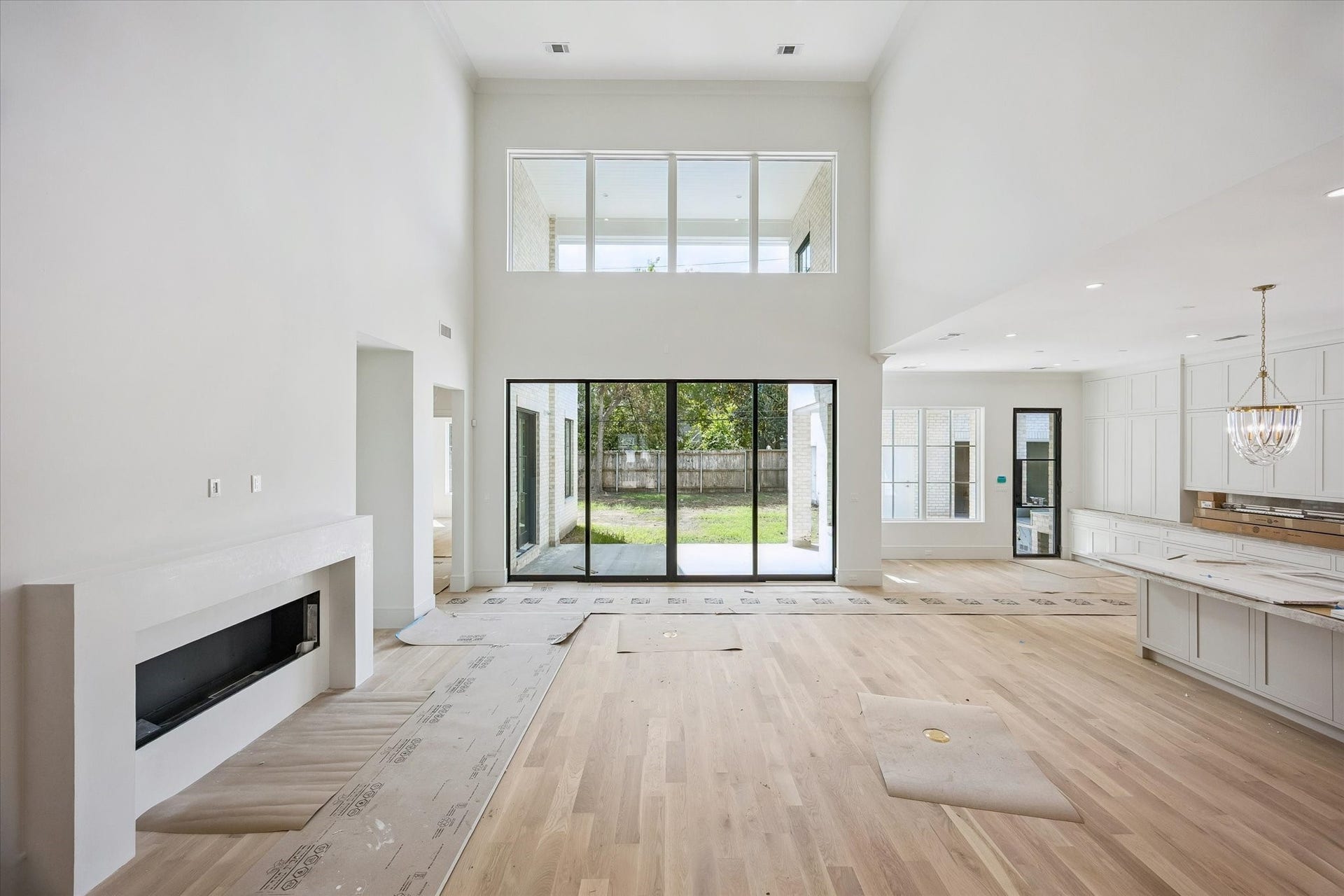 6011 Stones Throw Road, Houston, TX 77057 Living area features a gas fireplace and sliding glass doors that fill the space with natural light.