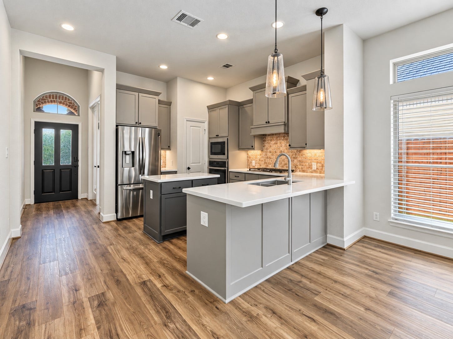 146 Dove Springs Court, Conroe, TX 77304 Step into the gorgeous chef-like kitchen. Enjoy preparing meals while still being close to family and friends hanging out in the living area.