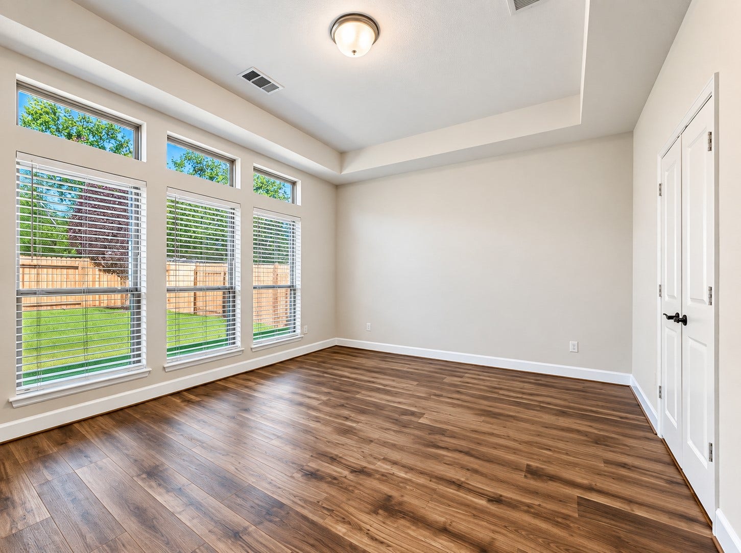 146 Dove Springs Court, Conroe, TX 77304 The primary suite offers tray ceilings, tons of natural light, custom built-ins and space for a complete bedroom furniture set.