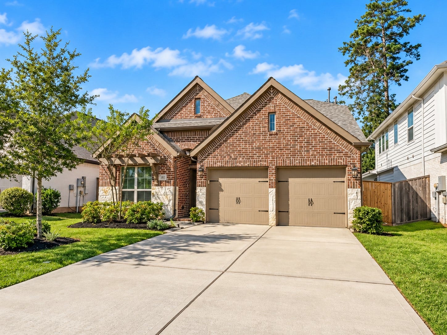 146 Dove Springs Court, Conroe, TX 77304 The long double-wide driveway offers plenty of room for guest to park while visiting.