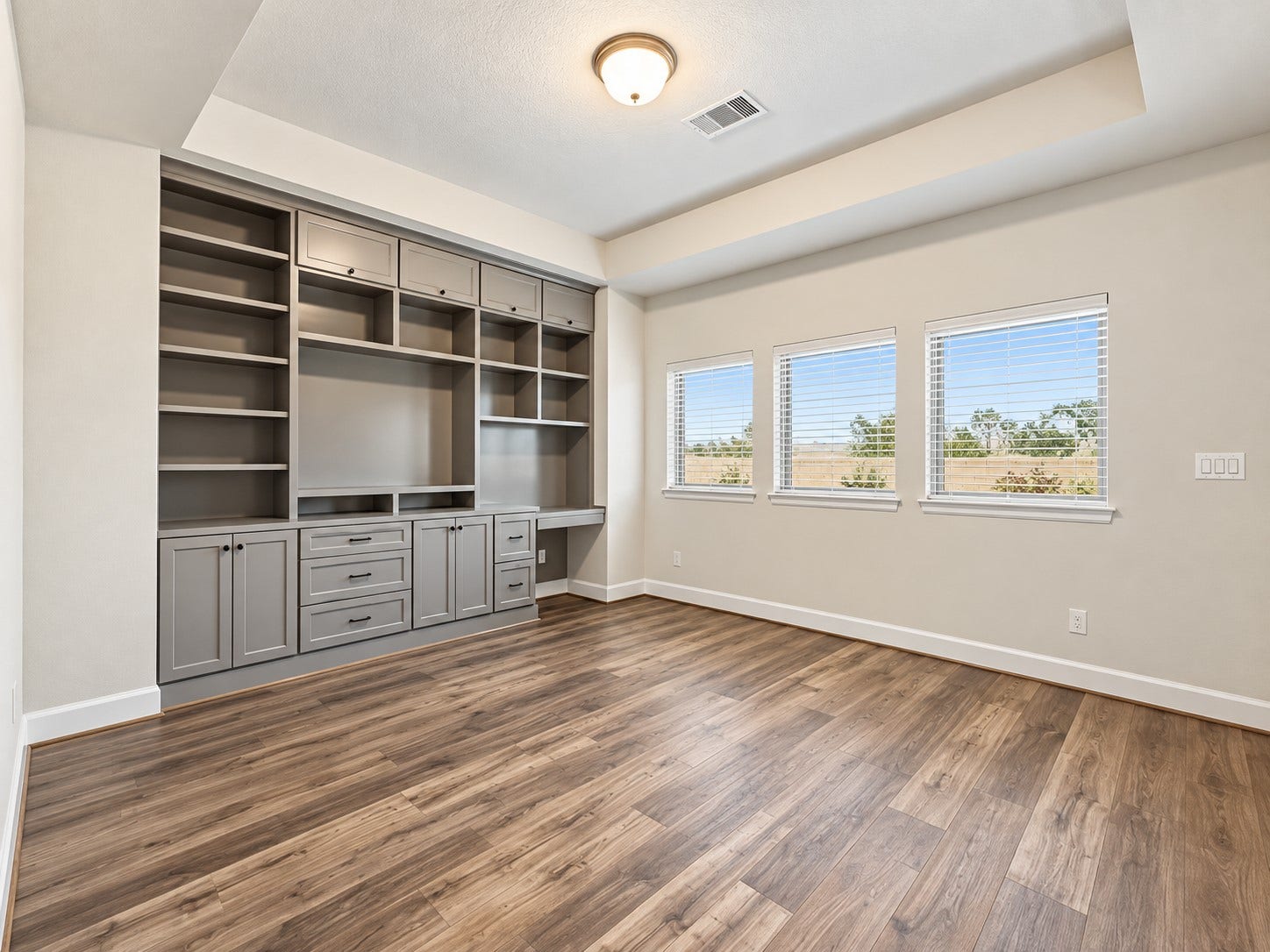 146 Dove Springs Court, Conroe, TX 77304 The custom-built entertainment center gives the game room a finished feel and creates the perfect setup for movie nights and relaxing together.