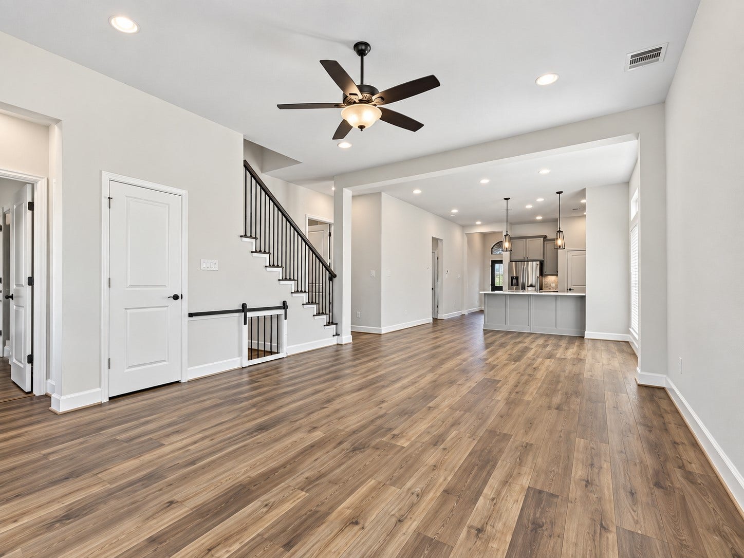 146 Dove Springs Court, Conroe, TX 77304 The open layout keeps everyone connected, whether youre preparing dinner in the kitchen, relaxing in the living room, or visiting around the island.