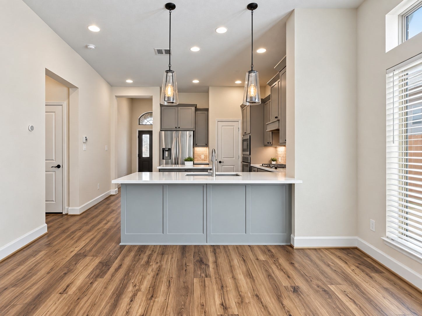 146 Dove Springs Court, Conroe, TX 77304 Beautiful pendant lighting gives a warm feel to the kitchen.