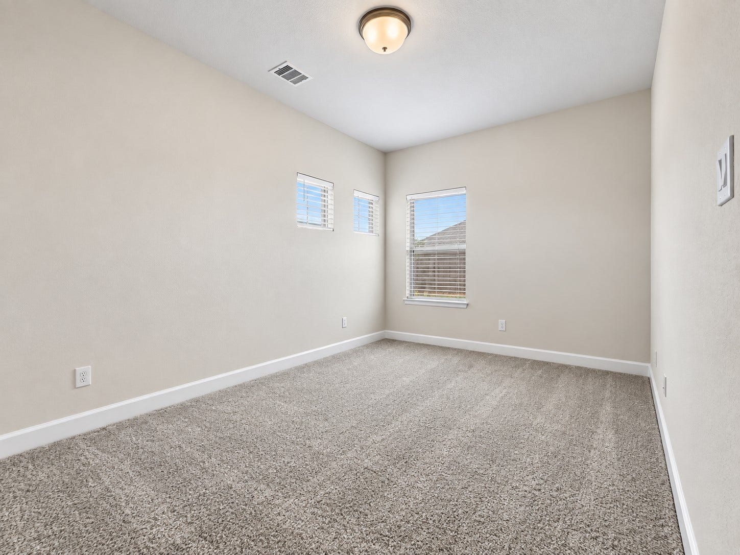 146 Dove Springs Court, Conroe, TX 77304 The upstairs secondary bedroom offers a comfortable private space for family members, guests, or a home-away-from-home feel.